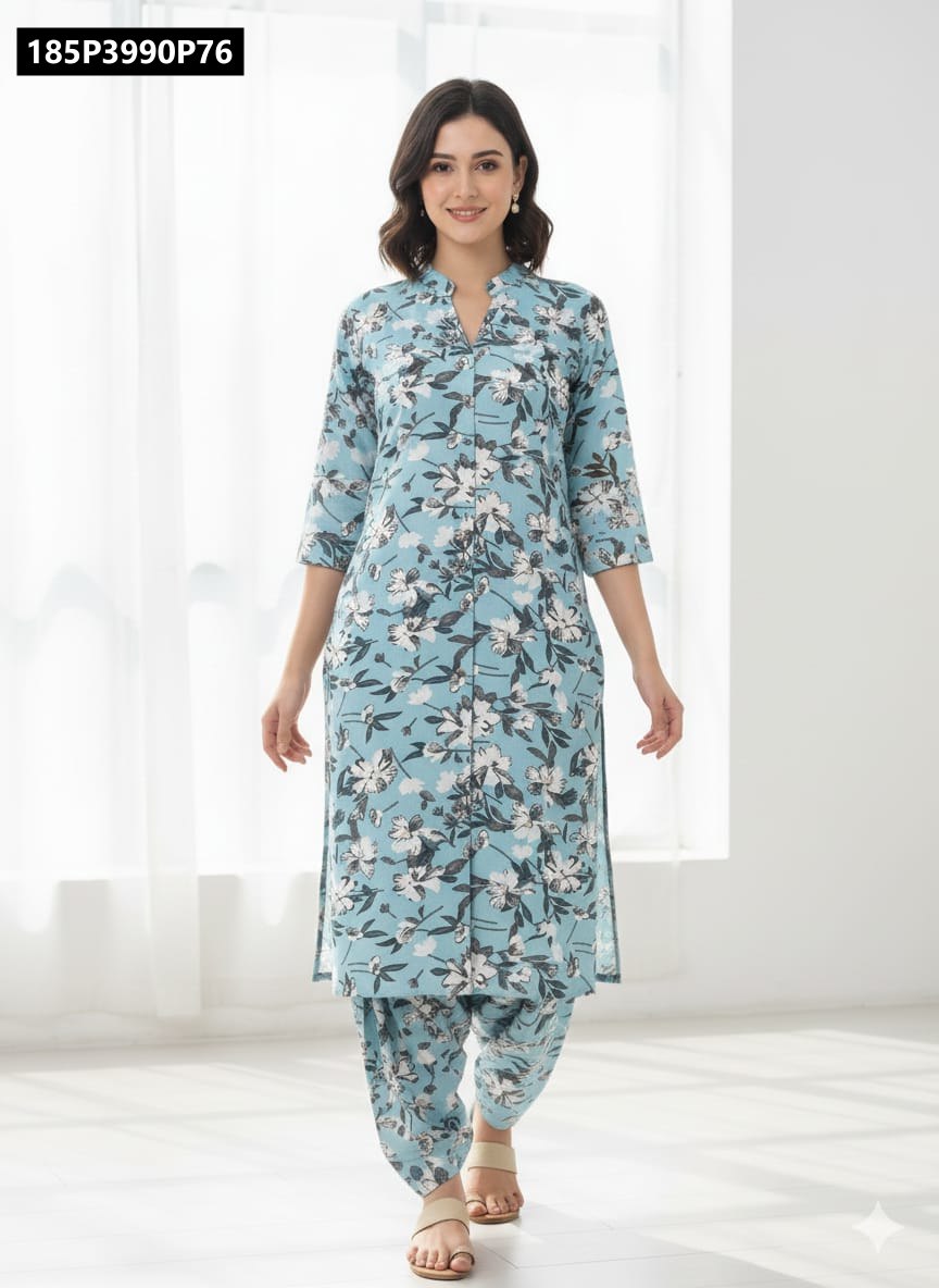 Model wearing TRENDBUY light blue floral A-line kurti with matching Afghani pants, full body view, in a bright room.