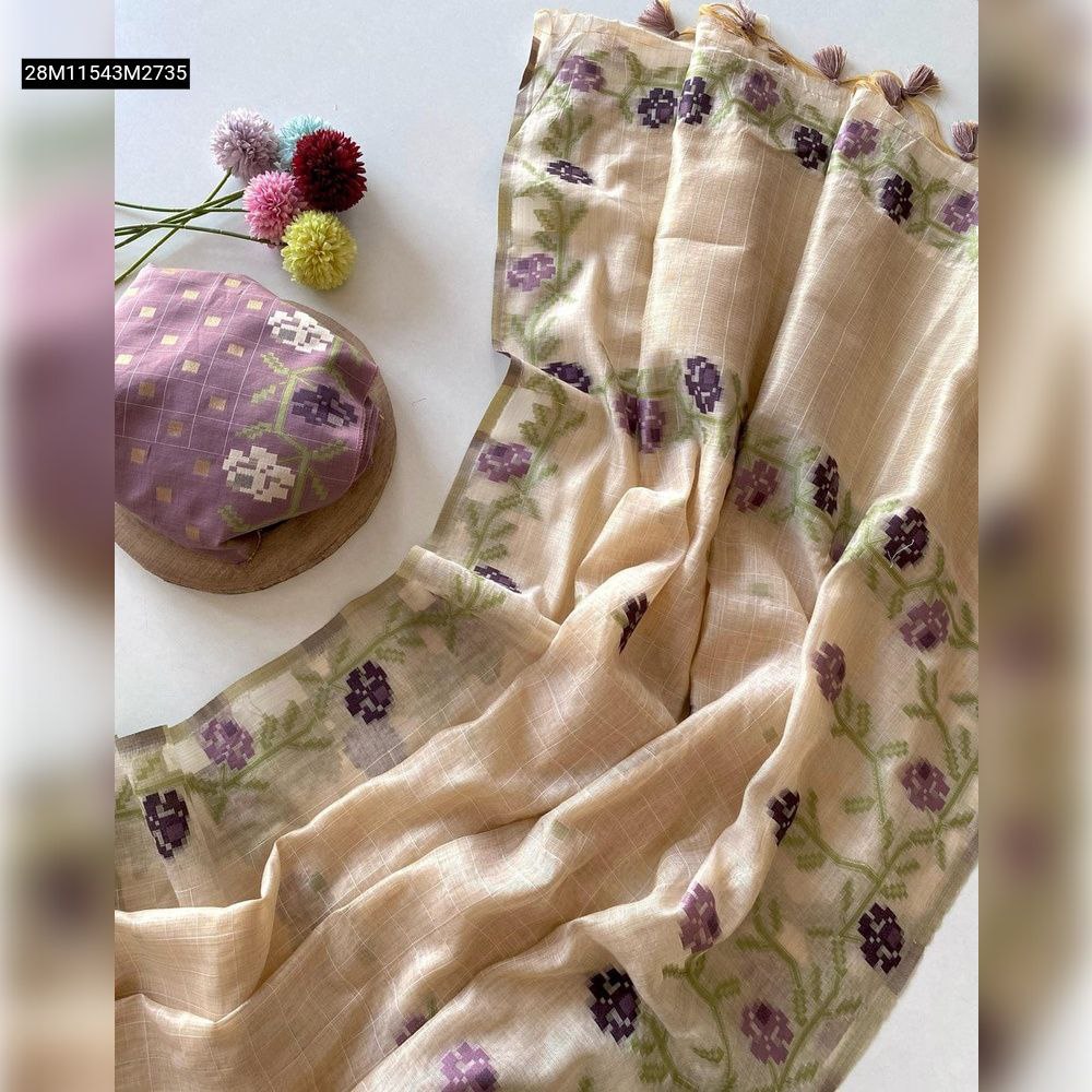 TRENDBUY Premium Muga Cotton Jamdani Saree in beige with elegant lavender floral weaving and a contrasting purple blouse piece, laid out on a clean white background.