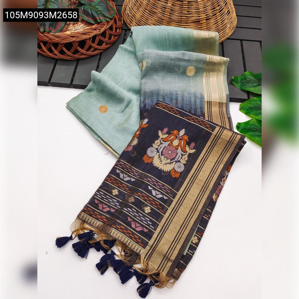 TRENDBUY Muga Cotton Saree in Mint Green with Dark Grey Pallu, featuring vibrant resham parrot motifs, golden zari border, and navy tassels, displayed on a white surface.