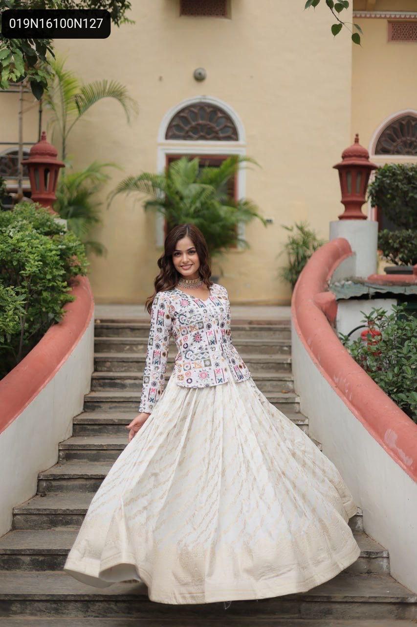 Model confidently posing in a vibrant multi-color embroidered peplum top and off-white jacquard lehenga, showcasing the full ensemble in an outdoor backdrop.