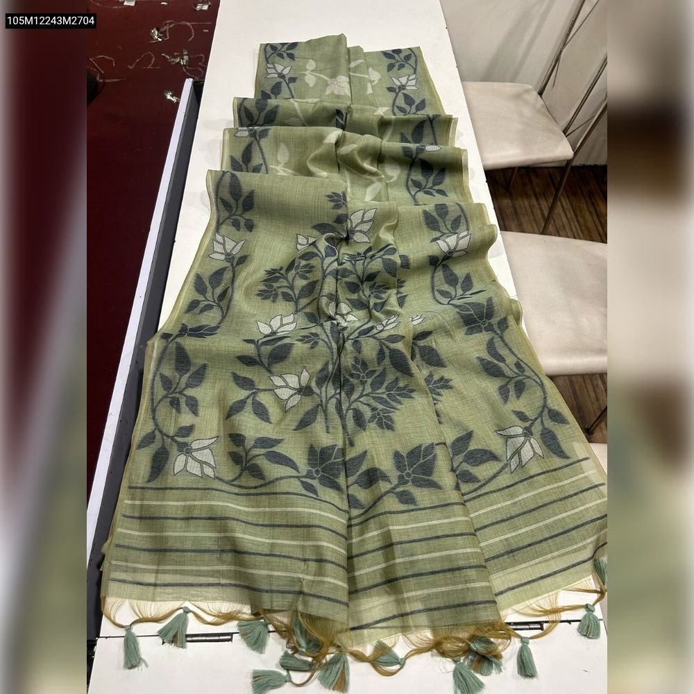 TRENDBUY Light Green Muga Cotton Saree with dark foliage Jamdani weave and striped border, laid flat.