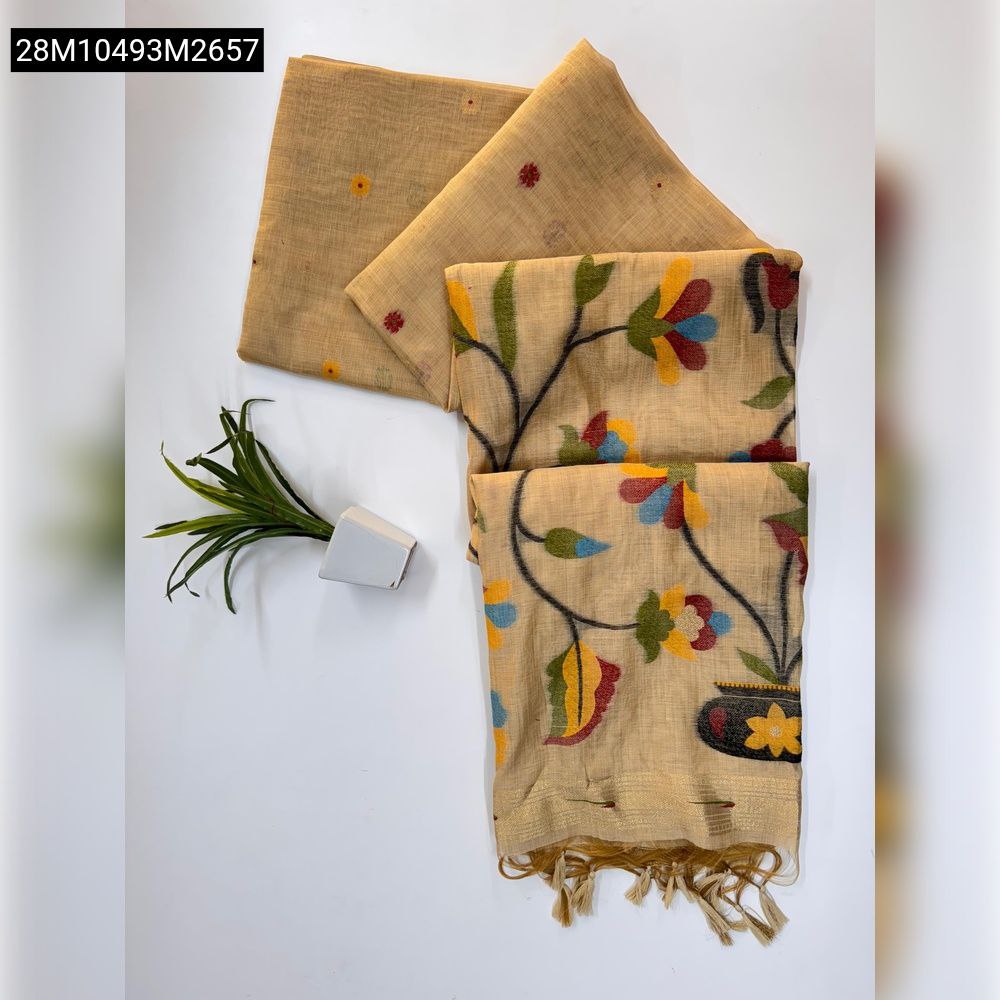 TRENDBUY Beige Muga Cotton saree set with floral pallu, zari border, and matching blouse piece on white background, beside a small plant.
