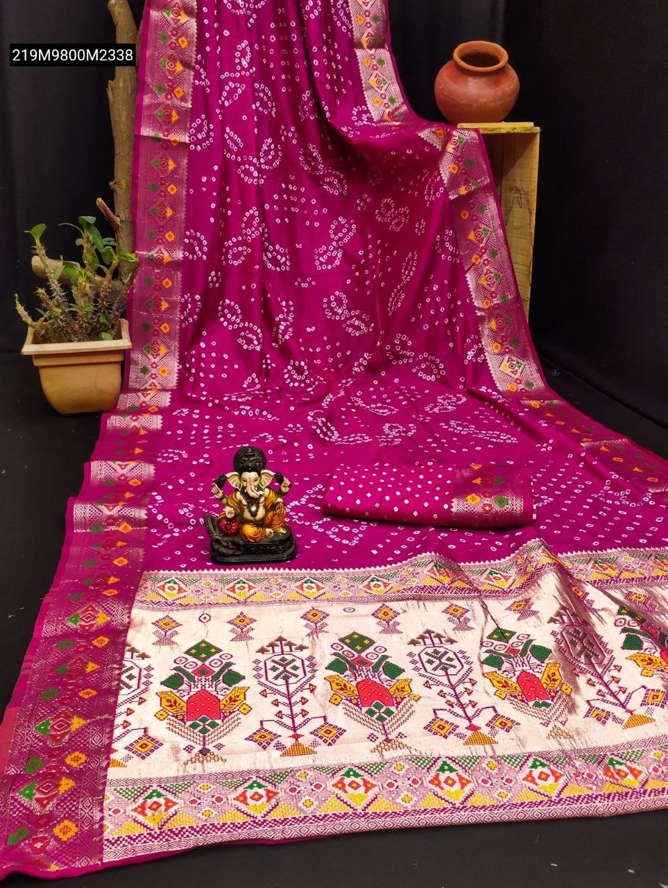 TRENDBUY Magenta Bandhej Silk Saree with detailed Patola border and Zari Paithani pallu, draped elegantly.
