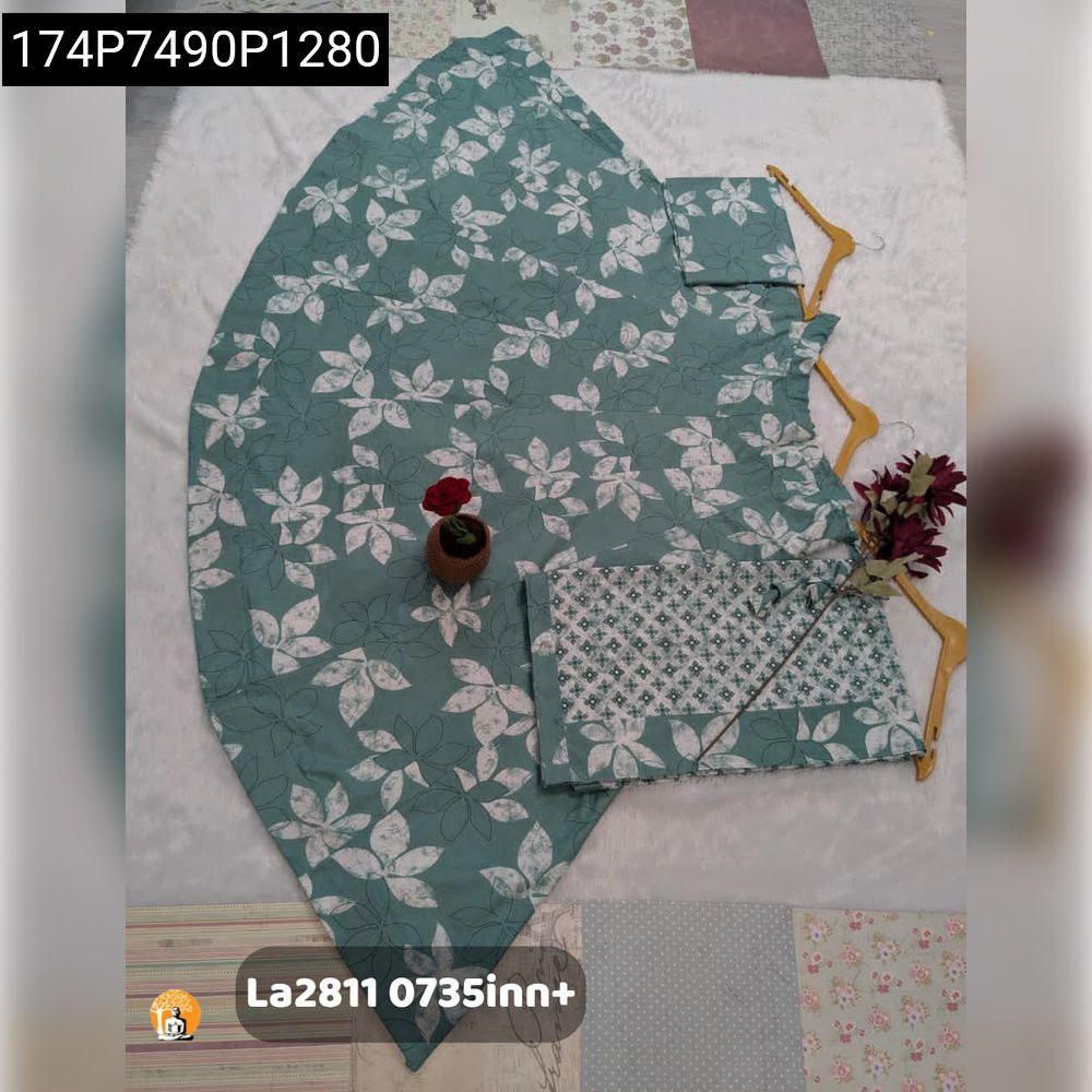 TRENDBUY Teal Green floral print Camric Cotton lehenga, geometric blouse piece, and dupatta laid flat