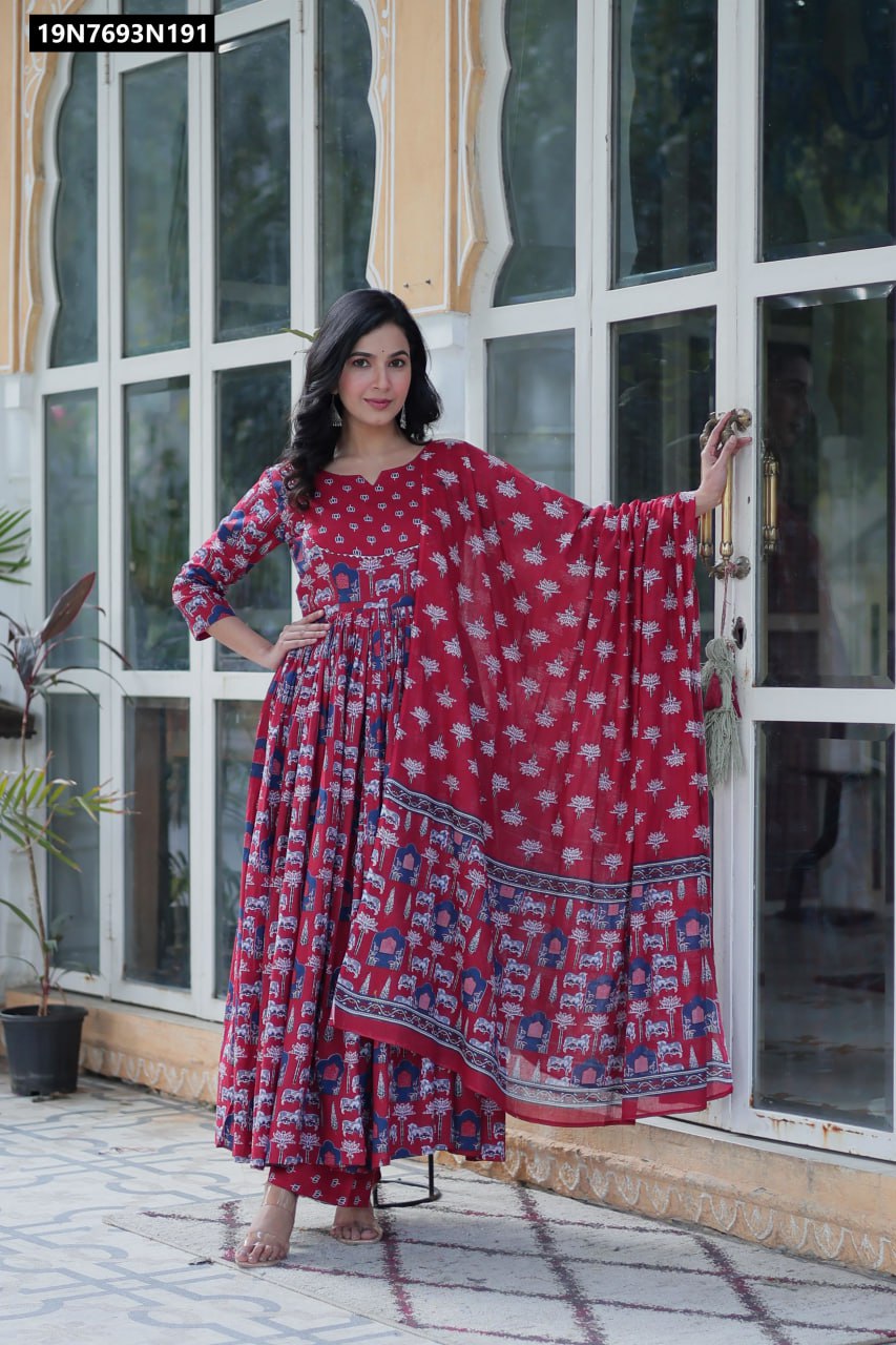 TRENDBUY Pure Cotton Printed Anarkali Kurta Set in red with blue and white print, model posing confidently against a glass door