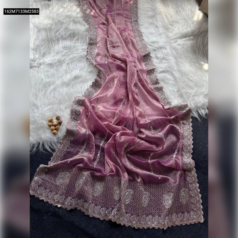 Full view of a stunning TRENDBUY Lavender Jimmychoo Silk Saree with intricate silver zari embroidery and subtle diamond work, draped gracefully on a white furry rug.