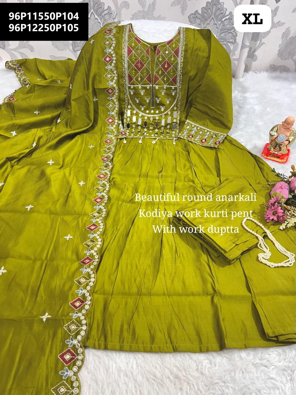 Flat lay of a vibrant green Pure Mull Chanderi Anarkali suit with intricate mirror and kodiya work on the neckline and dupatta border, size XL.