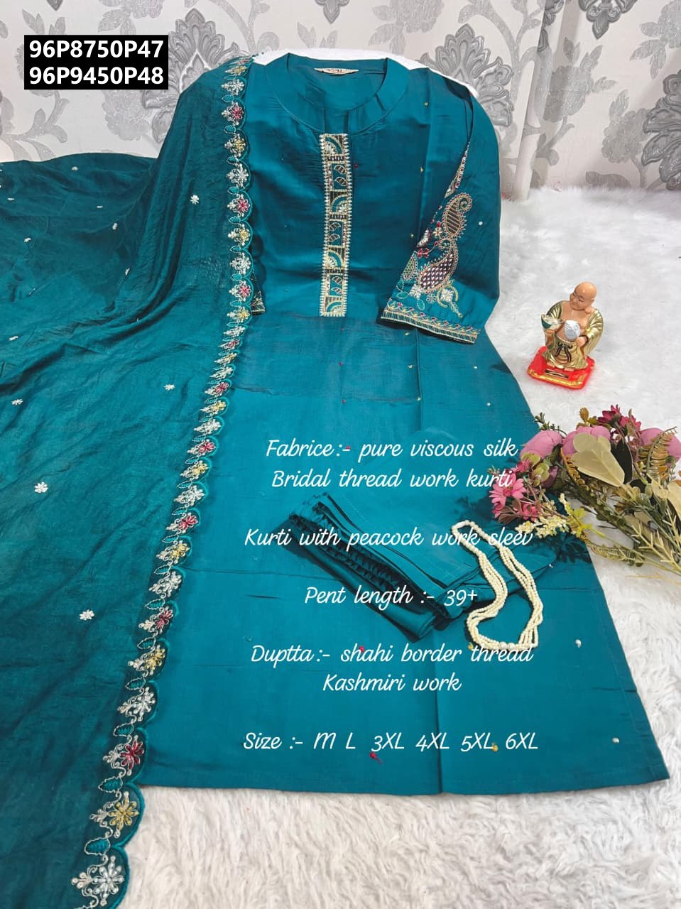 Full flat lay of a teal Pure Muslin Silk Kurta set, displaying the full length of the heavily embroidered dupatta, kurta with stand patti neck, and matching pant.