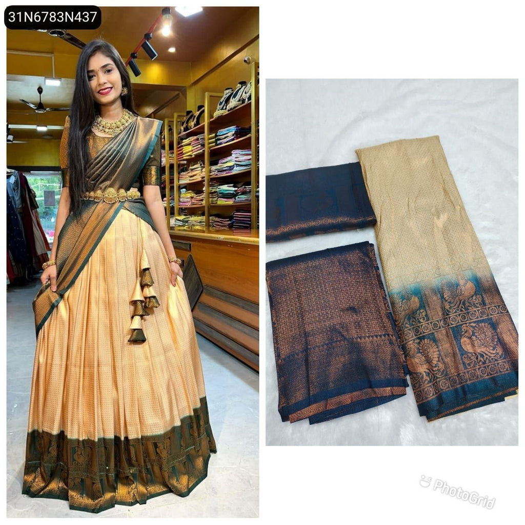 TRENDBUY model showcasing a Cream and Dark Teal Pure Softy Silk Half Saree Lehenga with Zari work, paired with traditional jewelry and a gold waist belt.