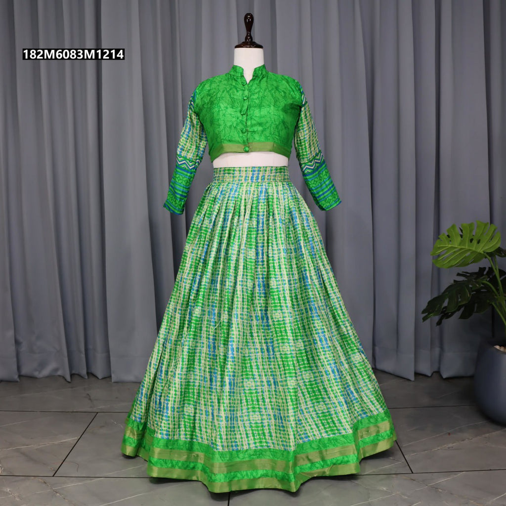 Full body view of a vibrant green Pure Tussar Silk Lehenga Choli set on a mannequin, highlighting the voluminous flared skirt with a zari woven border and a matching printed full-sleeve blouse.