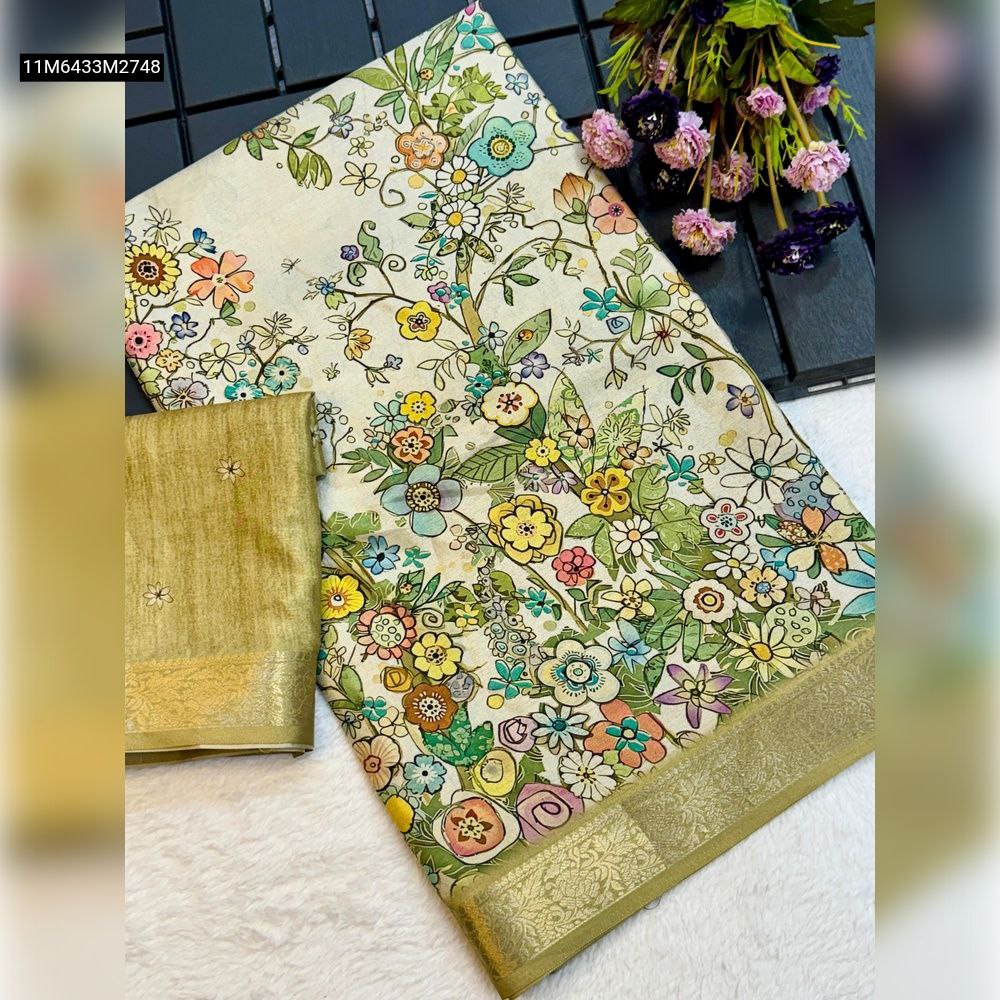 TRENDBUY Pure Tussar Silk Saree with multi-color digital floral print, green-gold weaving border, and matching green blouse piece, displayed neatly on a white surface.
