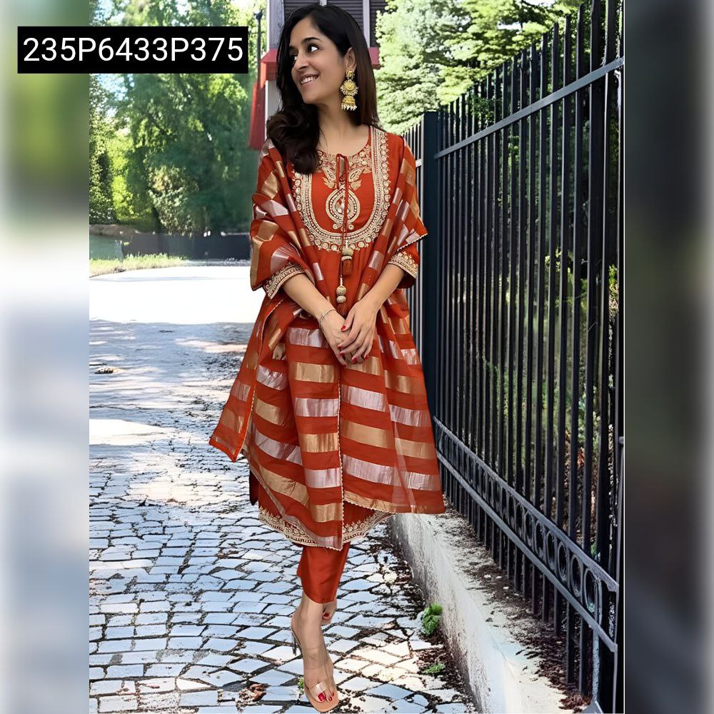 Model in TRENDBUY rust orange Pure Viscose Chanderi Kurti Set with gold sequence embroidery and striped jacquard dupatta, standing elegantly outdoors.