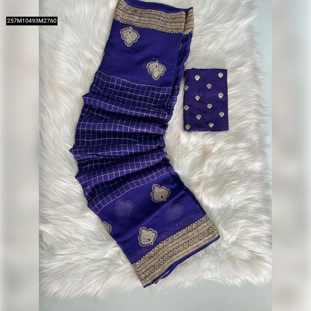 TRENDBUY Navy Blue Pure Viscose Georgette saree unfolded, showcasing intricate chit pallu embroidery and weaving border, with matching blouse piece, on a white fur rug.
