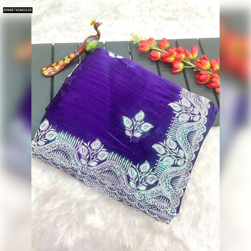 TRENDBUY Pure Zimmy Choo Silk Saree in vibrant purple, neatly folded, showcasing intricate silver sequin and multi-thread embroidery with an elegant arco cut work border on a white textured background.