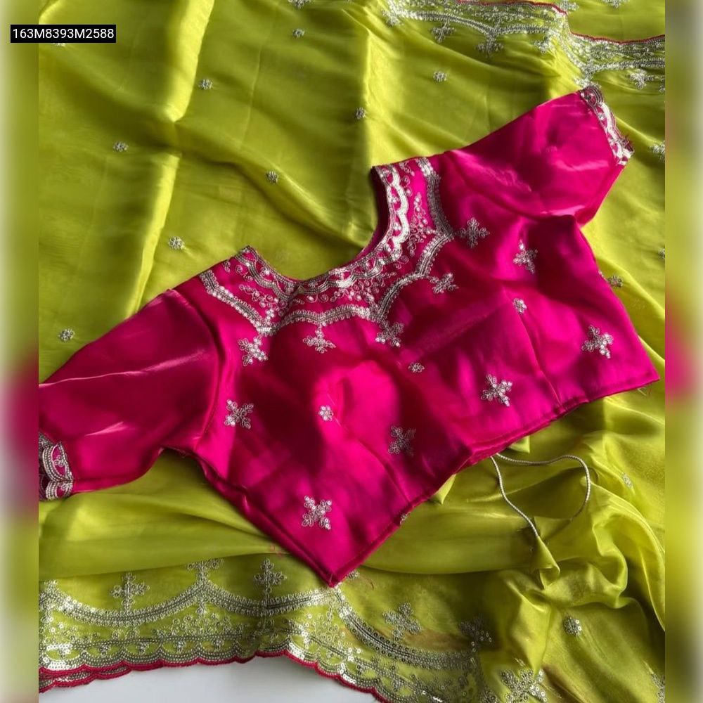 TRENDBUY Lime Green Zimmy Choo Silk Saree with silver Zari and sequin embroidery paired with a vibrant Hot Pink embroidered unstitched blouse.