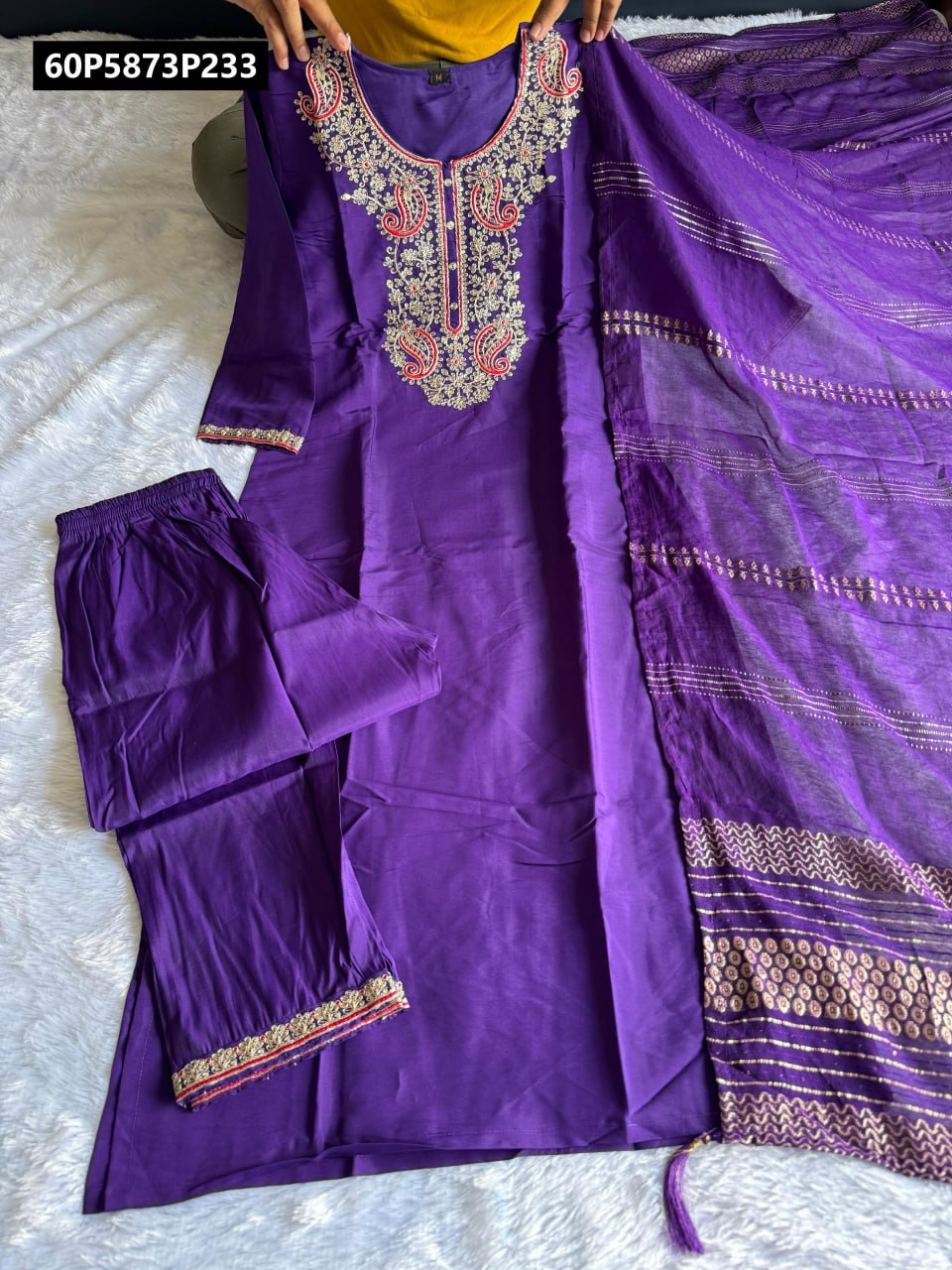 Full view of the TRENDBUY Purple Roman Silk Kurti set, held up to showcase the embroidered kurti, plain pants, and sequin-zari dupatta.