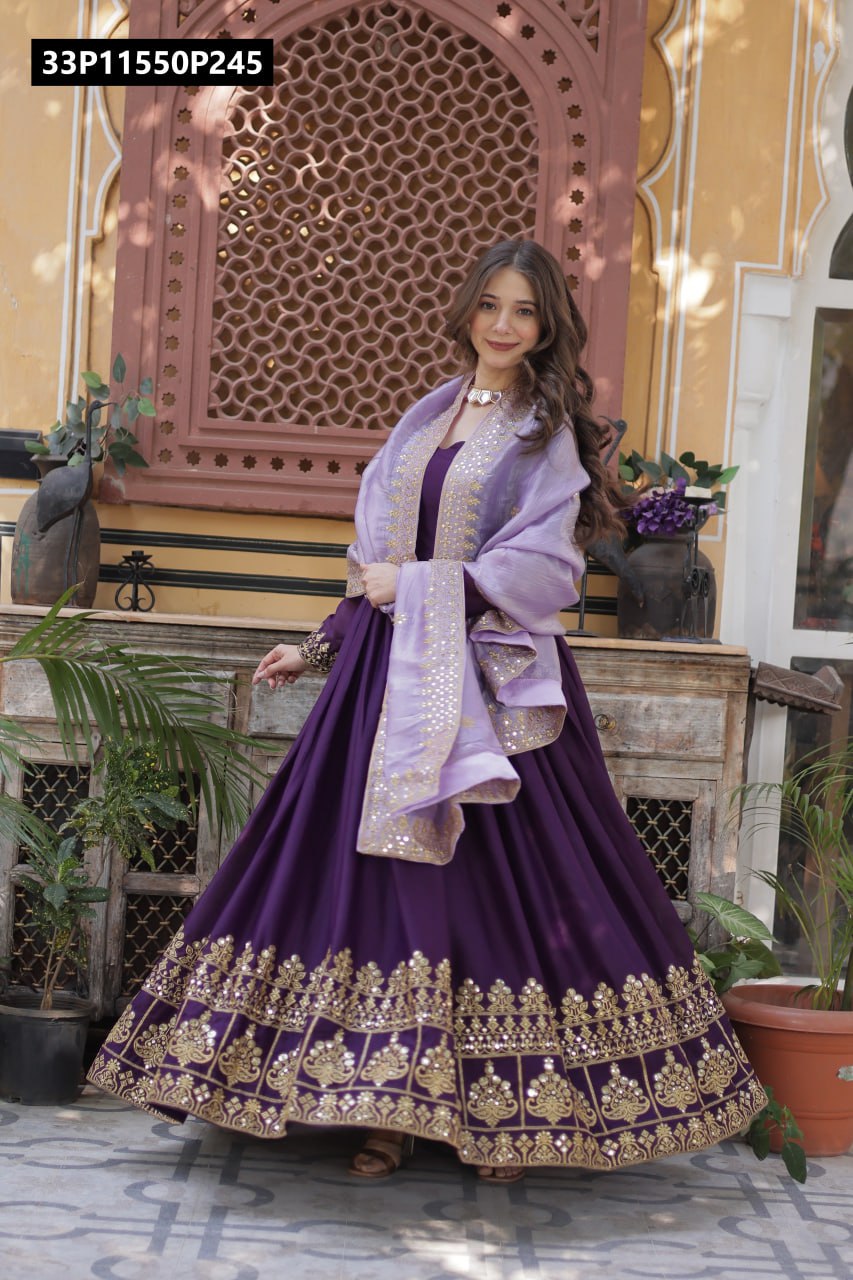 TRENDBUY Purple Star Georgette Gown with gold zari & sequin embroidery, flowing flair, and a lavender dupatta, model posing gracefully.
