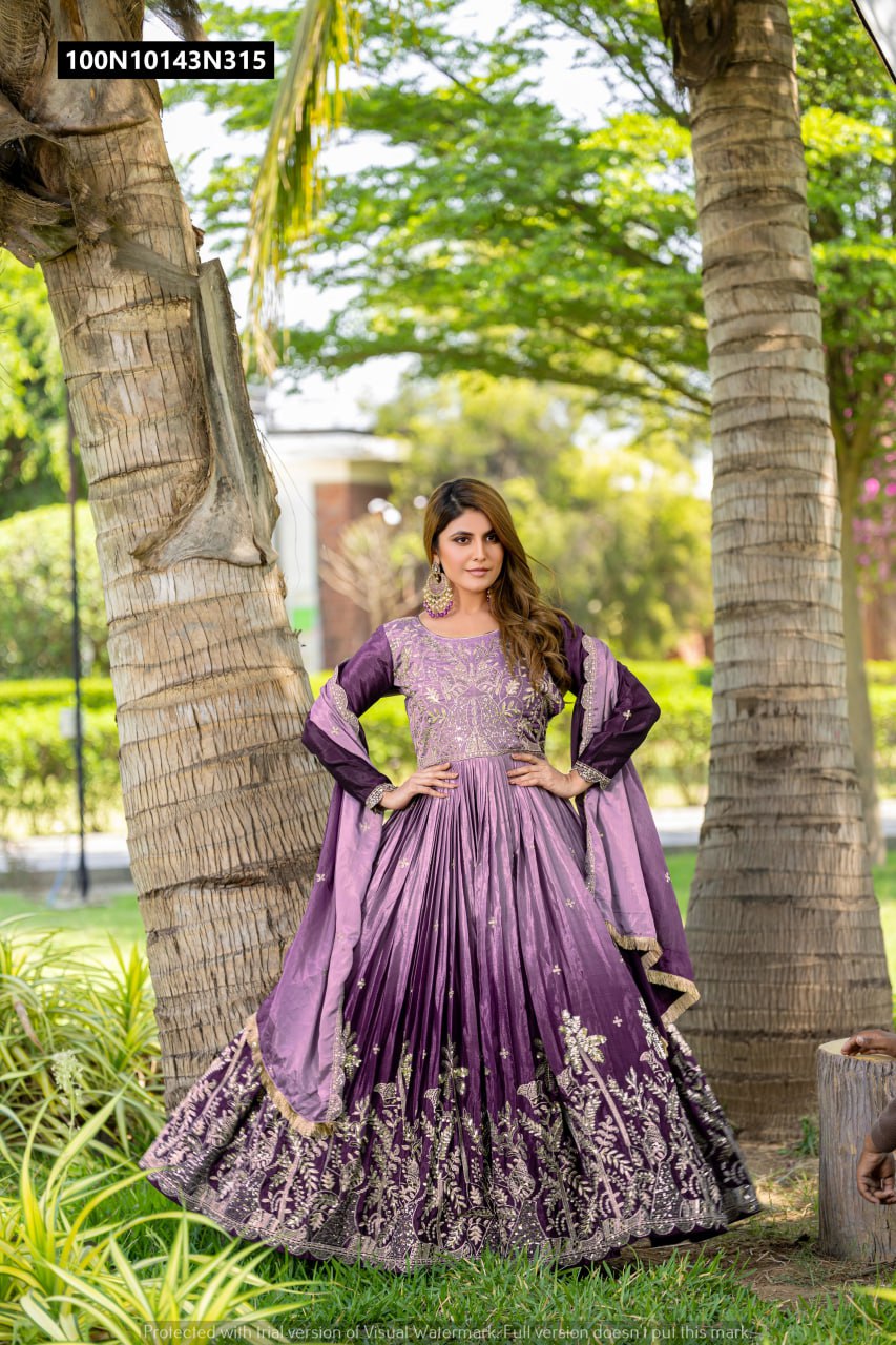 Model showcasing the TRENDBUY purple ombre chinon anarkali gown with full flair and detailed sequence embroidery, standing outdoors.