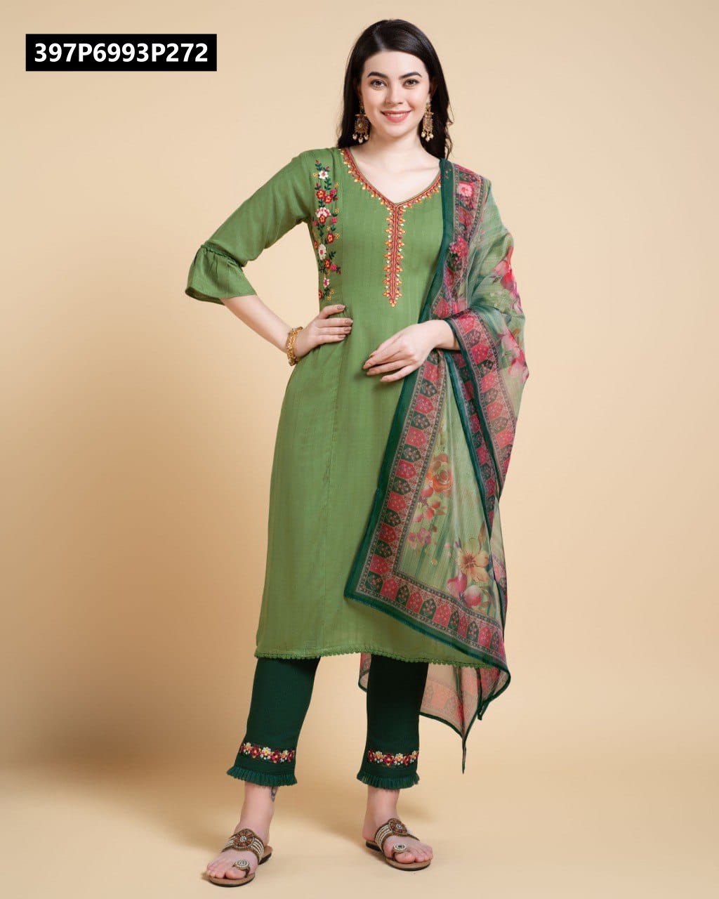 Full body front view of a model elegantly posing in the TRENDBUY olive green rayon kurta set, complete with dark green pants and a floral organza dupatta.