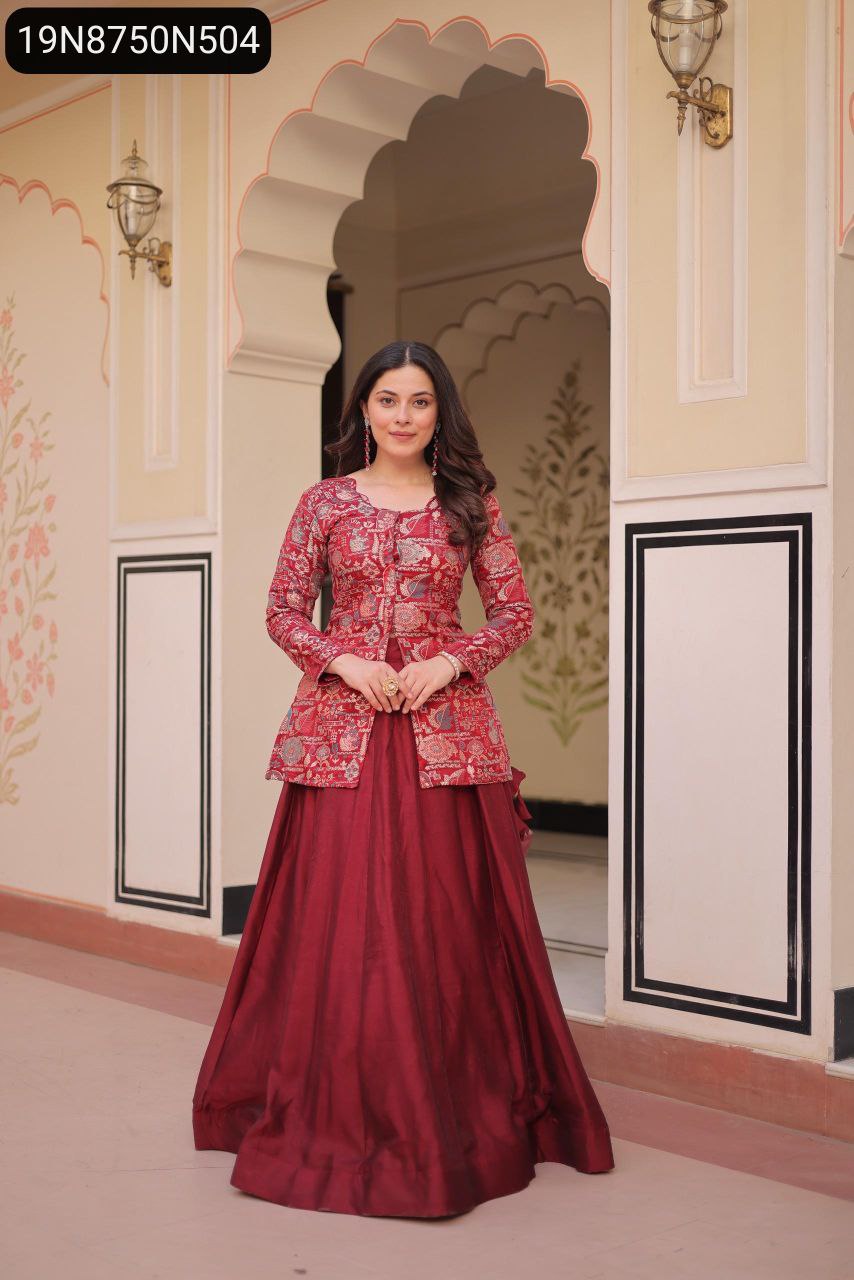 Elegant model in a maroon TRENDBUY simmer vichitra lehenga choli set, smiling and posing confidently against a traditional backdrop.
