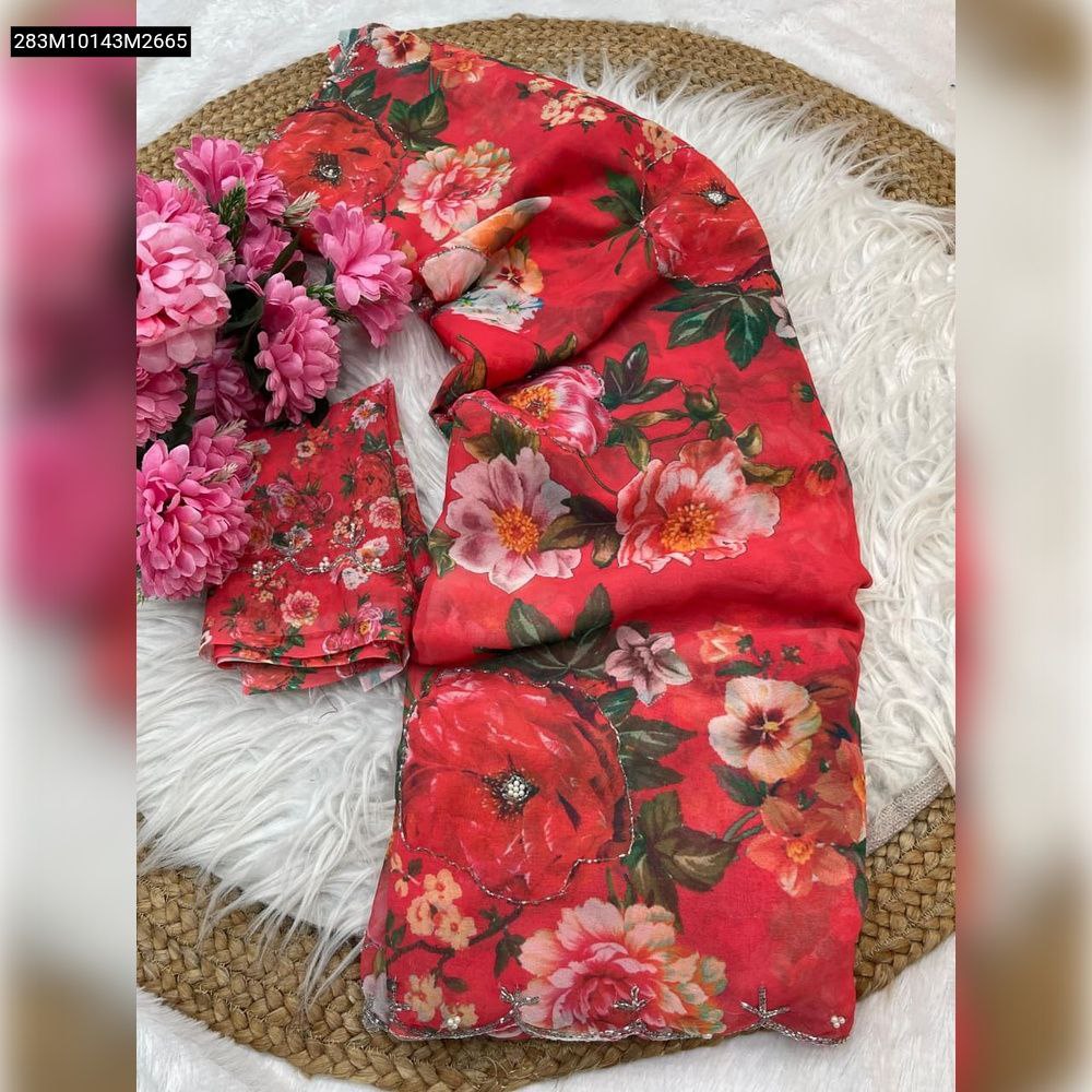 TRENDBUY Red Floral Georgette Saree with Hand Khatli & Cutdana Work, elegantly draped with matching unstitched blouse and pink flowers on a white fur mat.