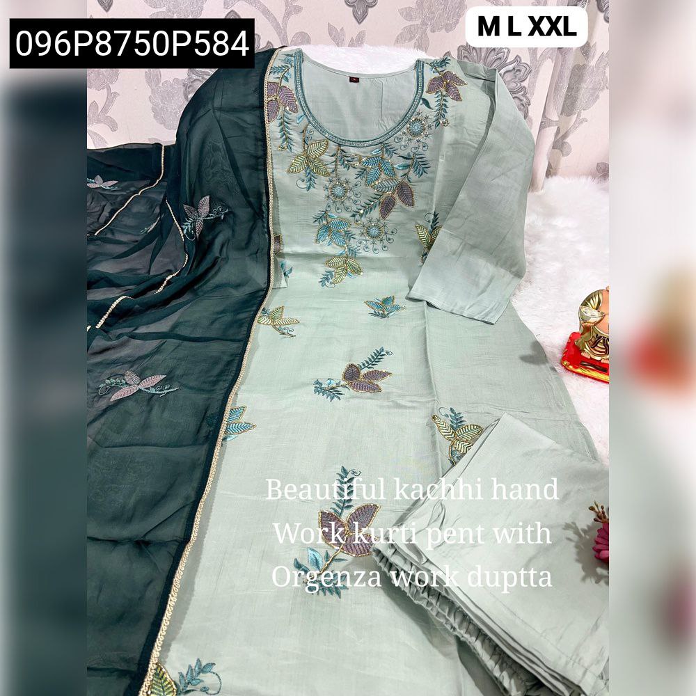 Full view of a mint green Roman silk kurta pant dupatta set with intricate Kolkata hand embroidery, draped dark green contrast dupatta showing lace patti.