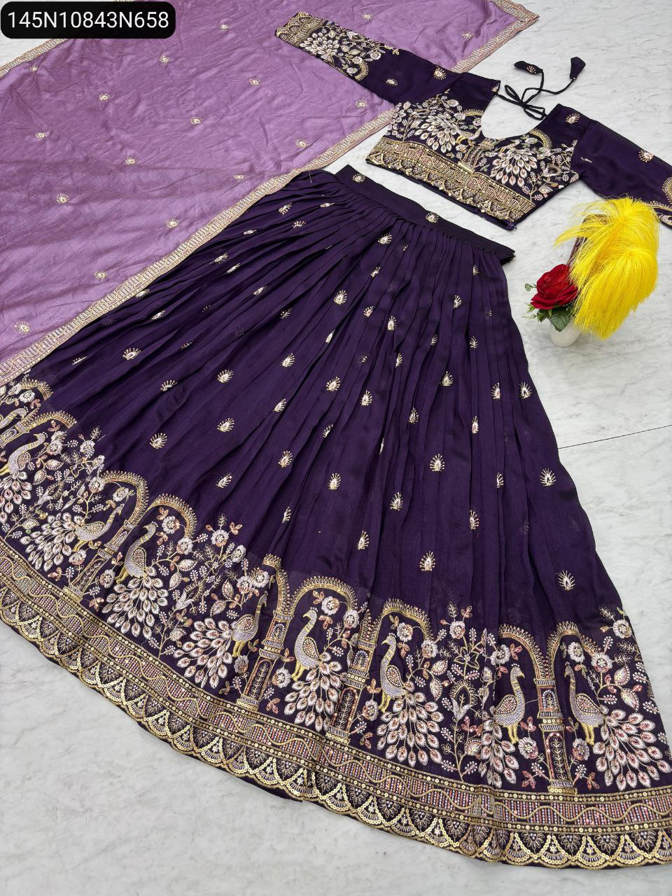 Close-up of intricate peacock motif embroidery with gold thread and sequence work