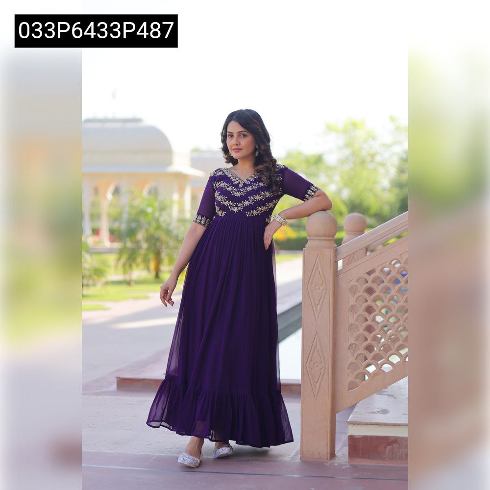 Model posing in a full-length purple TRENDBUY faux blooming gown with gold sequin embroidery, leaning on an ornate stone railing.