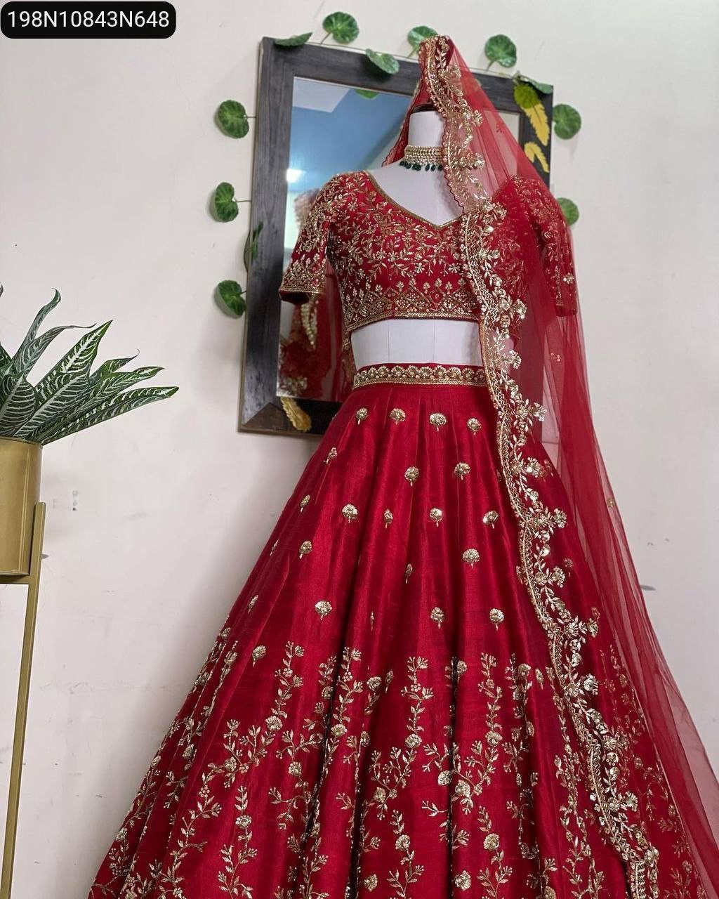 TRENDBUY Red Sequin Embroidered Malay Satin Silk Lehenga Choli with Dupatta on mannequin, full view with indoor plant.