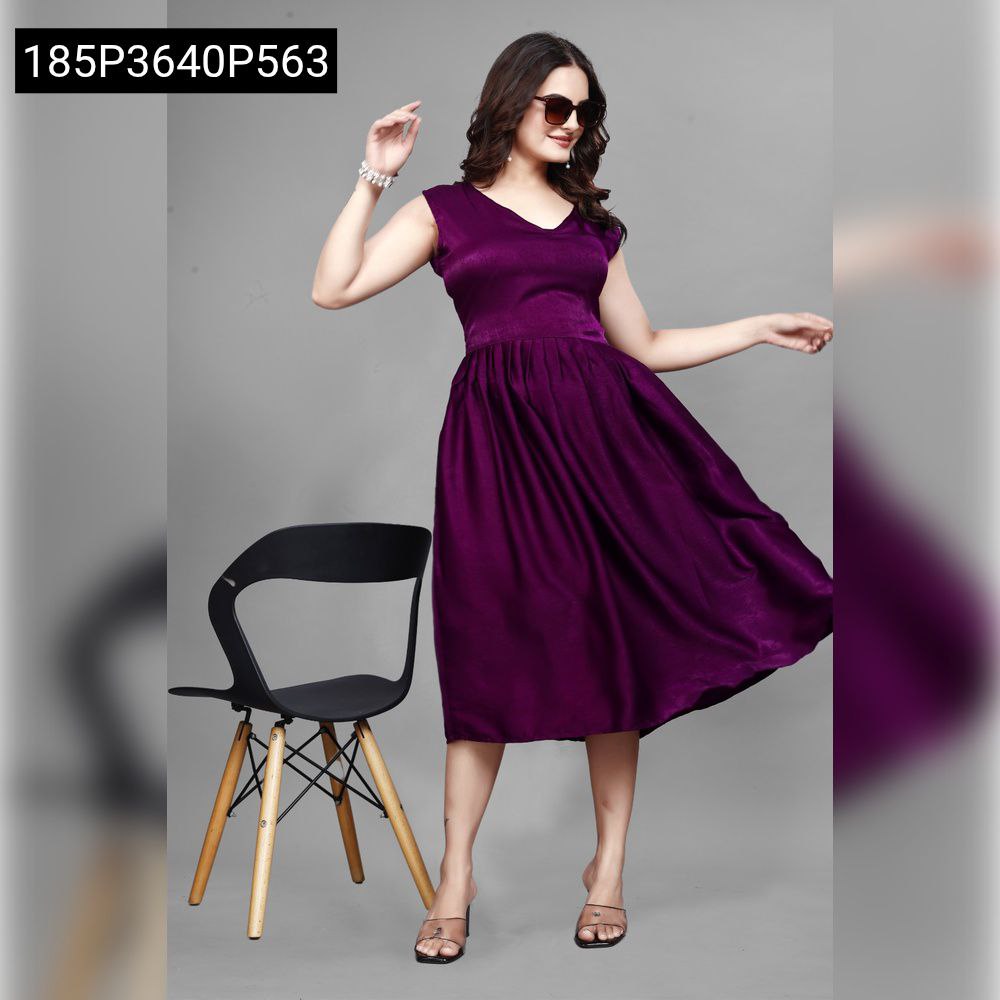 Model in TRENDBUY purple sleeveless velvet midi dress, V-neck, pleated skirt, with attached belt, posing frontally with sunglasses and chair.