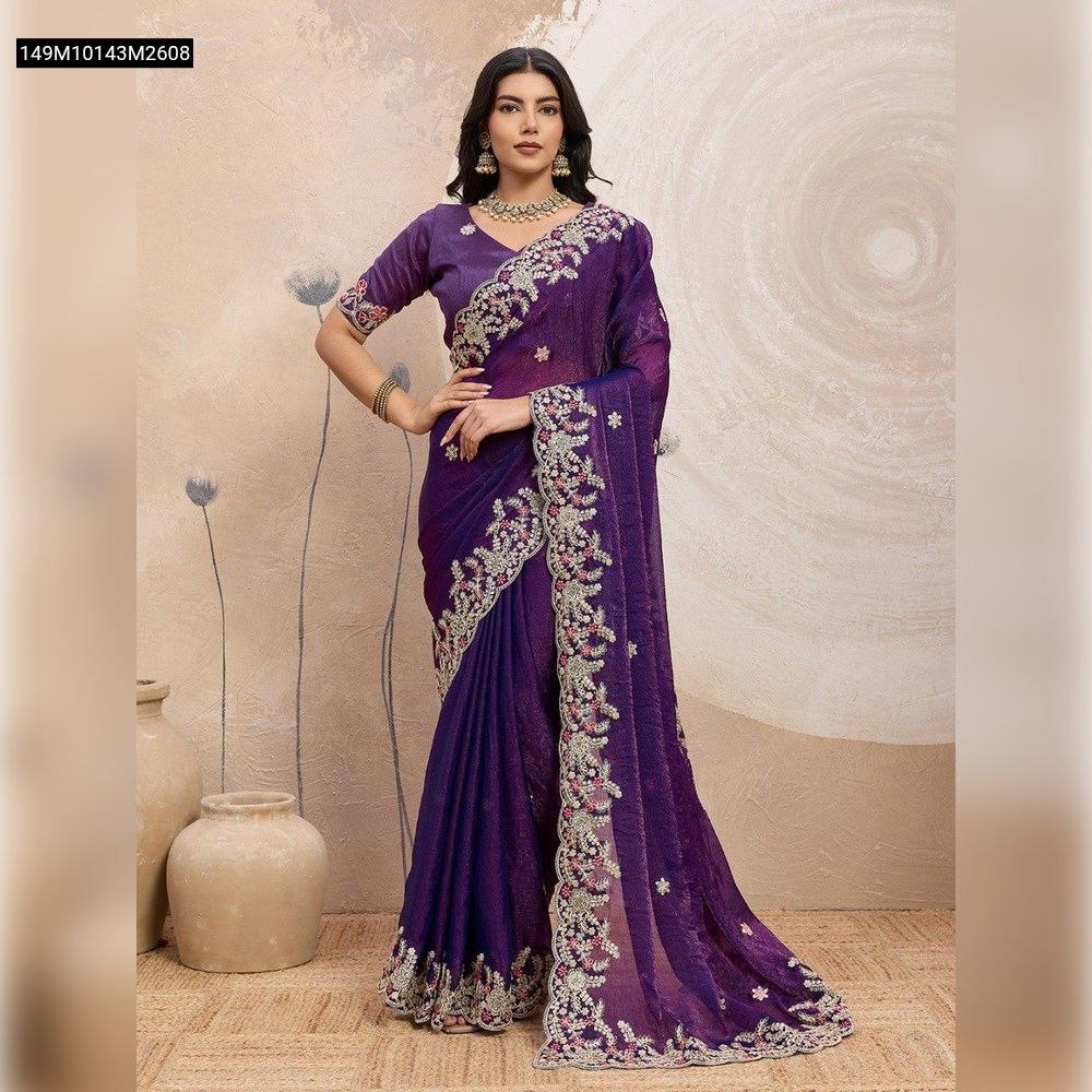 Full body shot of a model wearing a deep purple TRENDBUY Soft Space Silk saree with intricate embroidery, standing elegantly.