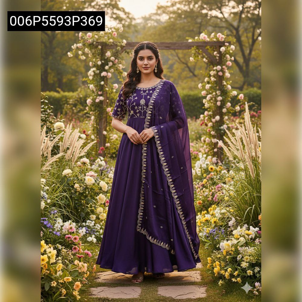 TRENDBUY model in a deep purple sparkling georgette Anarkali gown with golden embroidery, standing in a lush garden pathway framed by flowers.