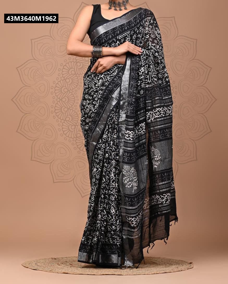 Full view of a woman draped in a black and white linen saree with abstract digital print and silver zari border