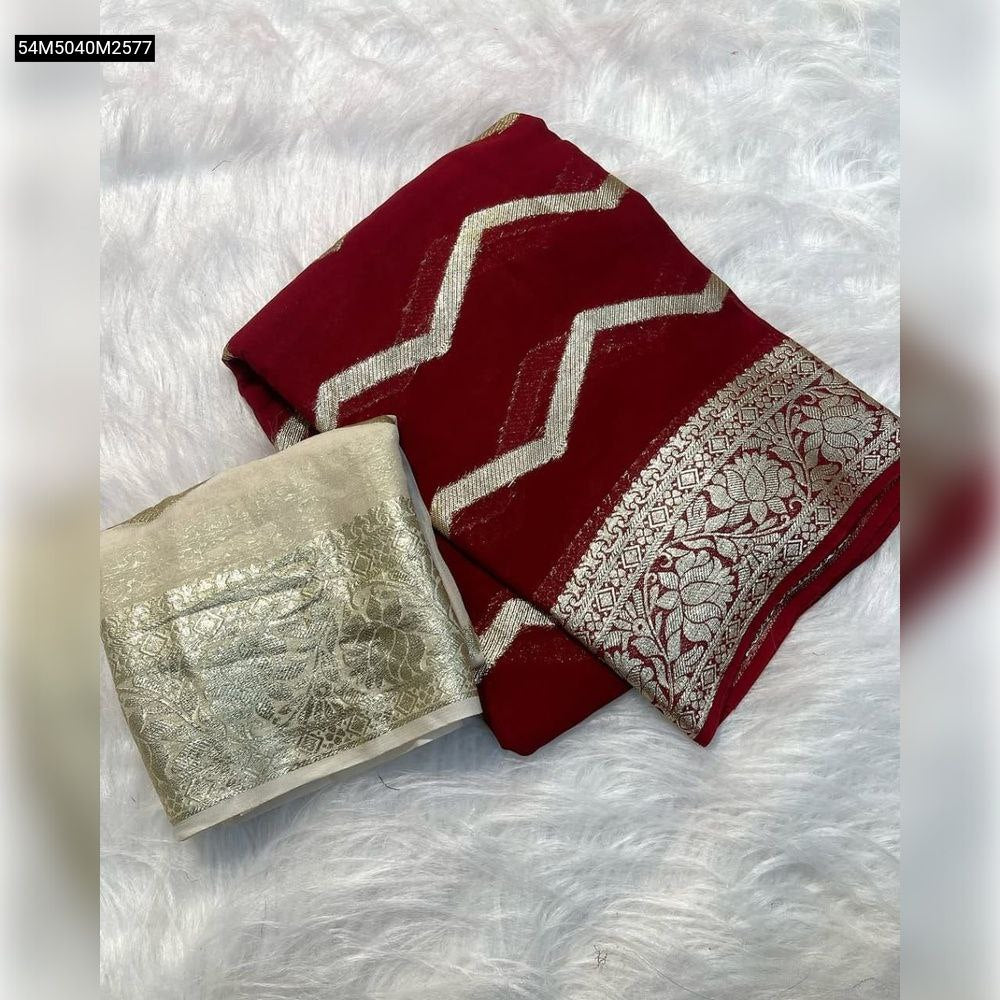 TRENDBUY Red Viscose Georgette Saree with silver zari chevron patterns and intricate floral border, paired with a cream contrast blouse, folded on white fur.
