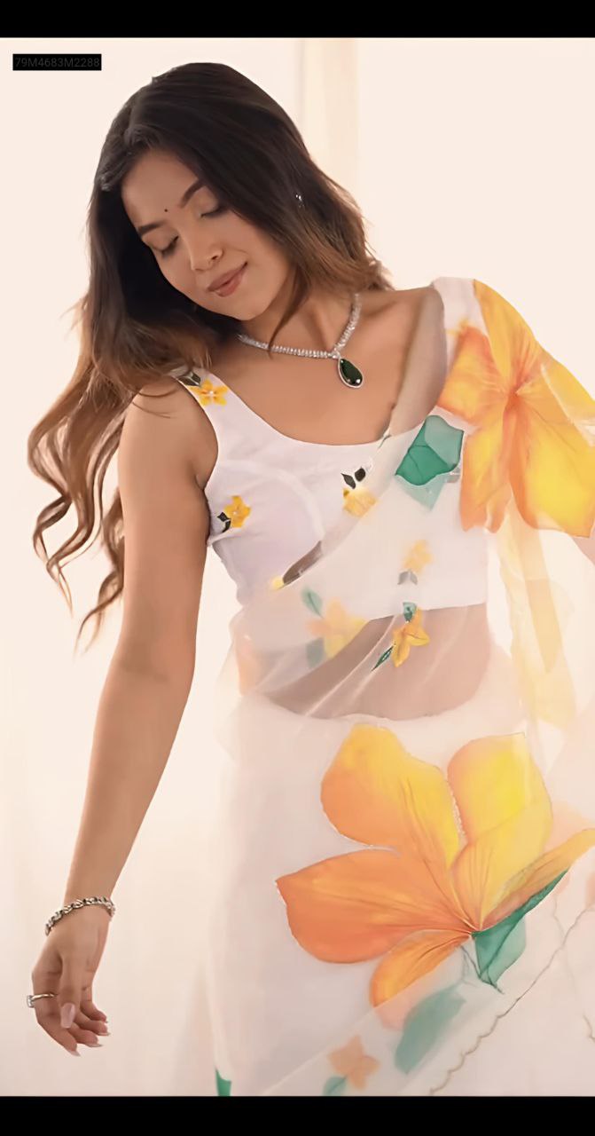 Upper body view of the model wearing the TRENDBUY floral print georgette saree, showcasing the sleeveless blouse and elegant neckline.