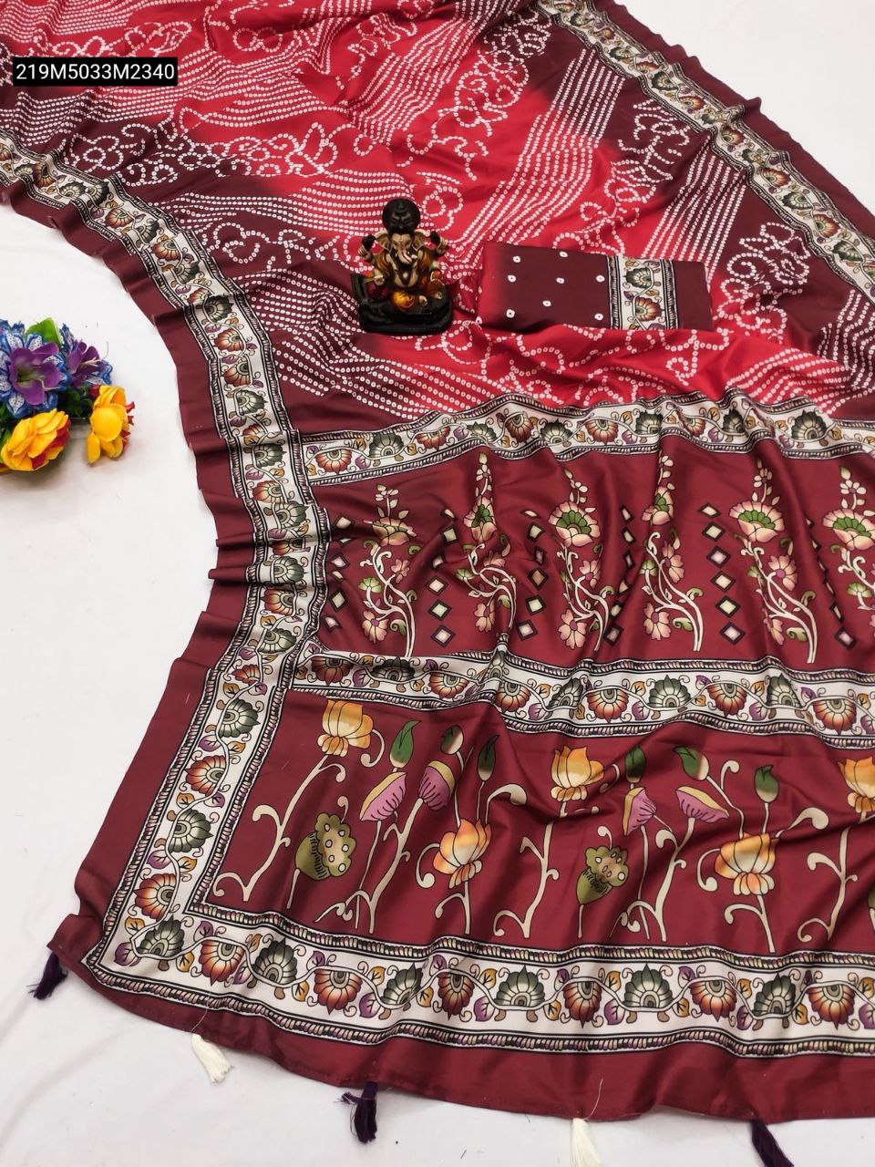 TRENDBUY Red and maroon Art Silk saree with white Bandhej dots and vibrant Kalamkari floral digital print border, flat lay view.