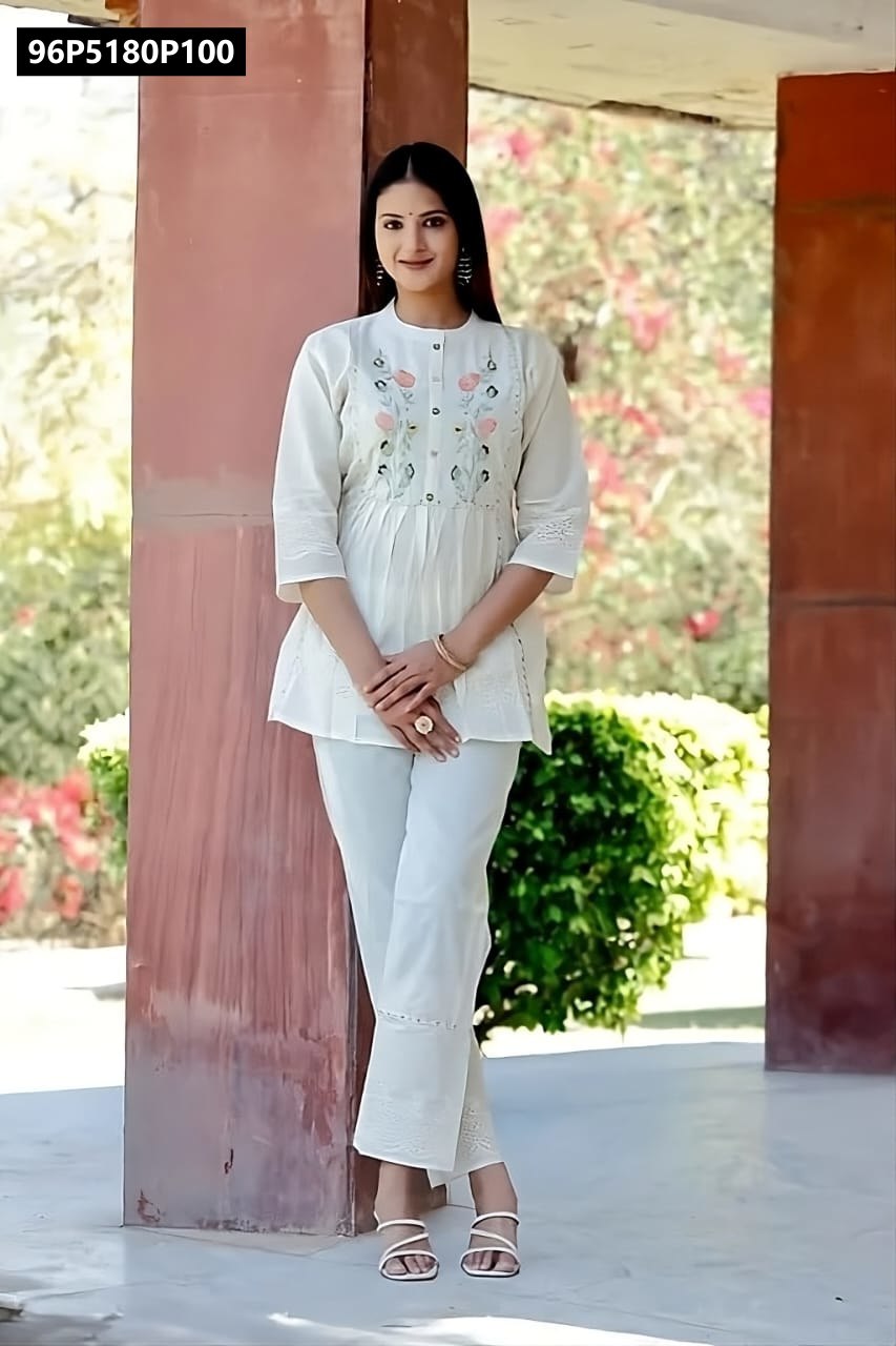 Full view of TRENDBUY Women's white cotton chikankari embroidered top with matching pants, model showcasing the complete elegant court set.