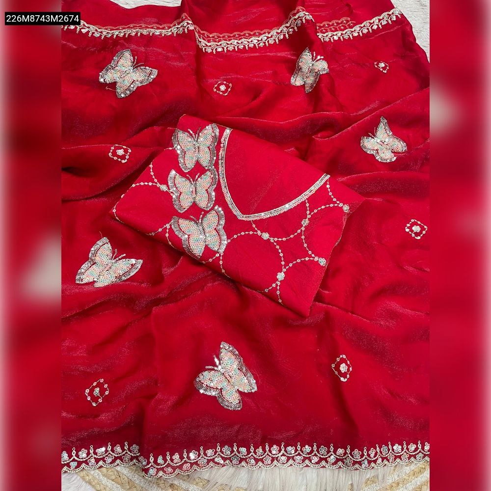 Vibrant red Fendy satin saree with intricate silver butterfly sequence embroidery and detailed border, showcasing the matching unstitched blouse piece on a light background.