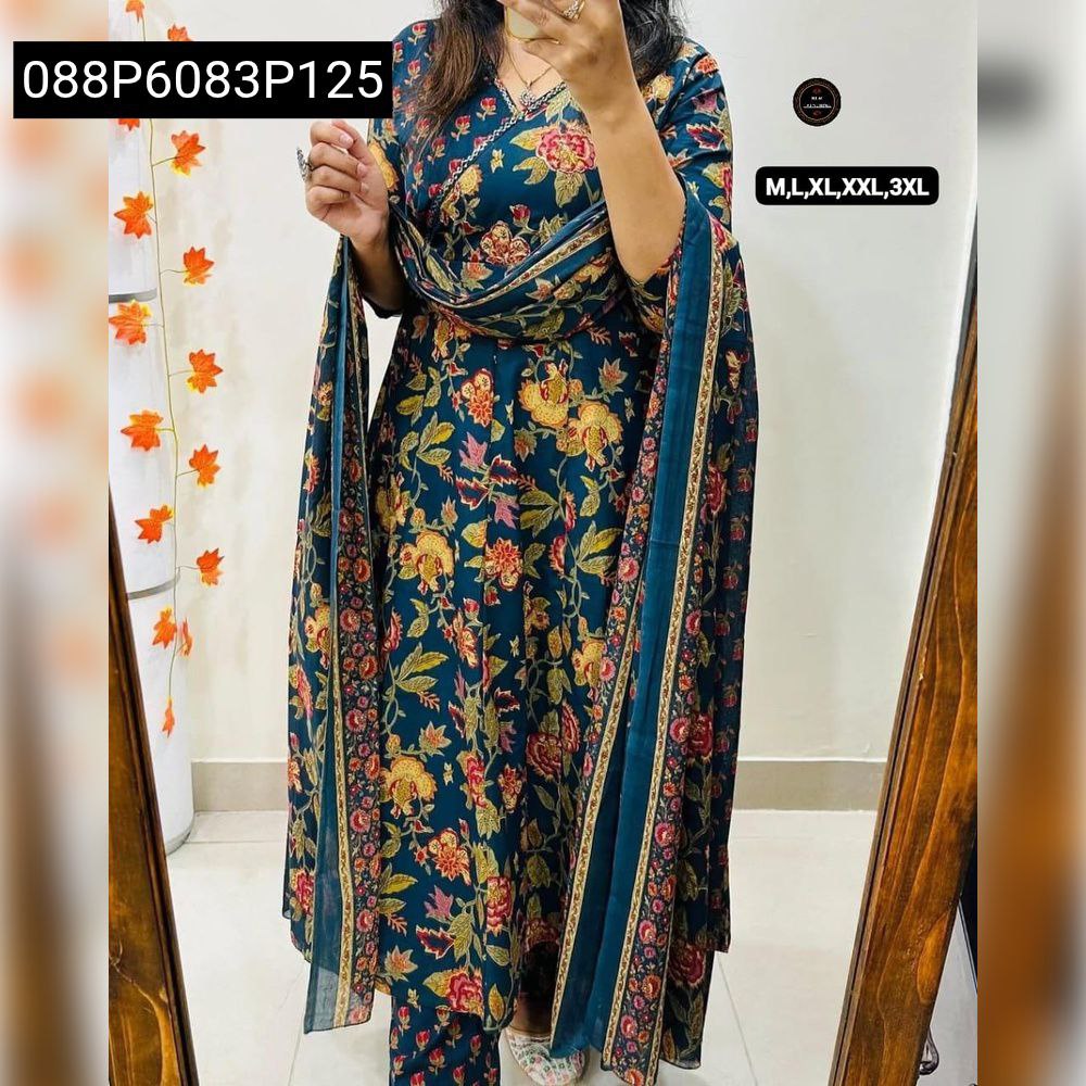 Model wearing a vibrant dark teal floral embroidered Anarkali kurta set with dupatta, captured in a full body shot.