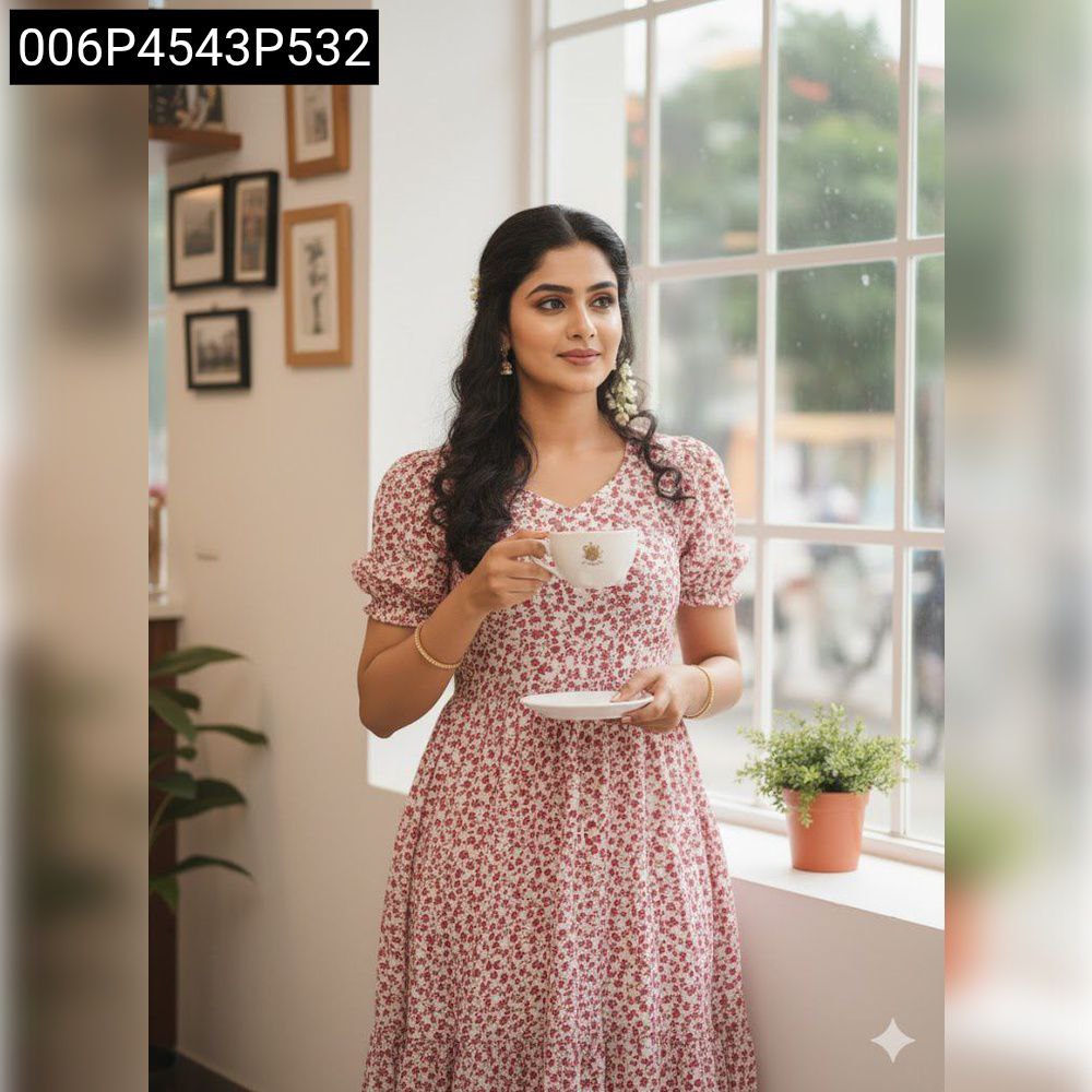 Model in TRENDBUY red and white floral georgette midi dress, standing by a window, holding a teacup, showcasing the v-neckline and short puff sleeves.