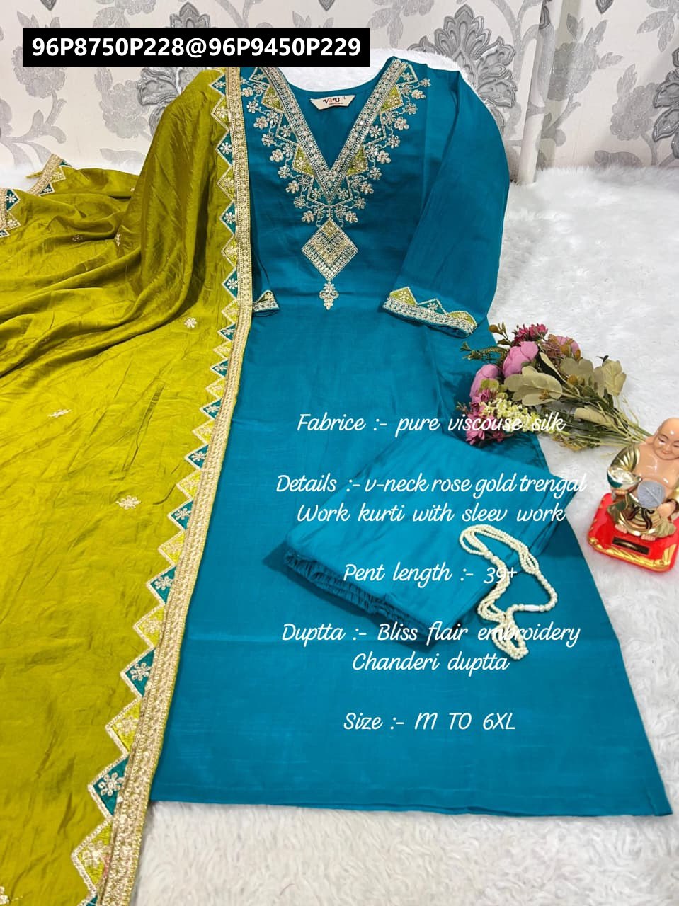 Full display of a Teal Blue heavy viscose embroidered kurta set with V-neck, matching pant, and a contrasting lime green chanderi dupatta, beautifully arranged on a white textured surface with decorative accents.
