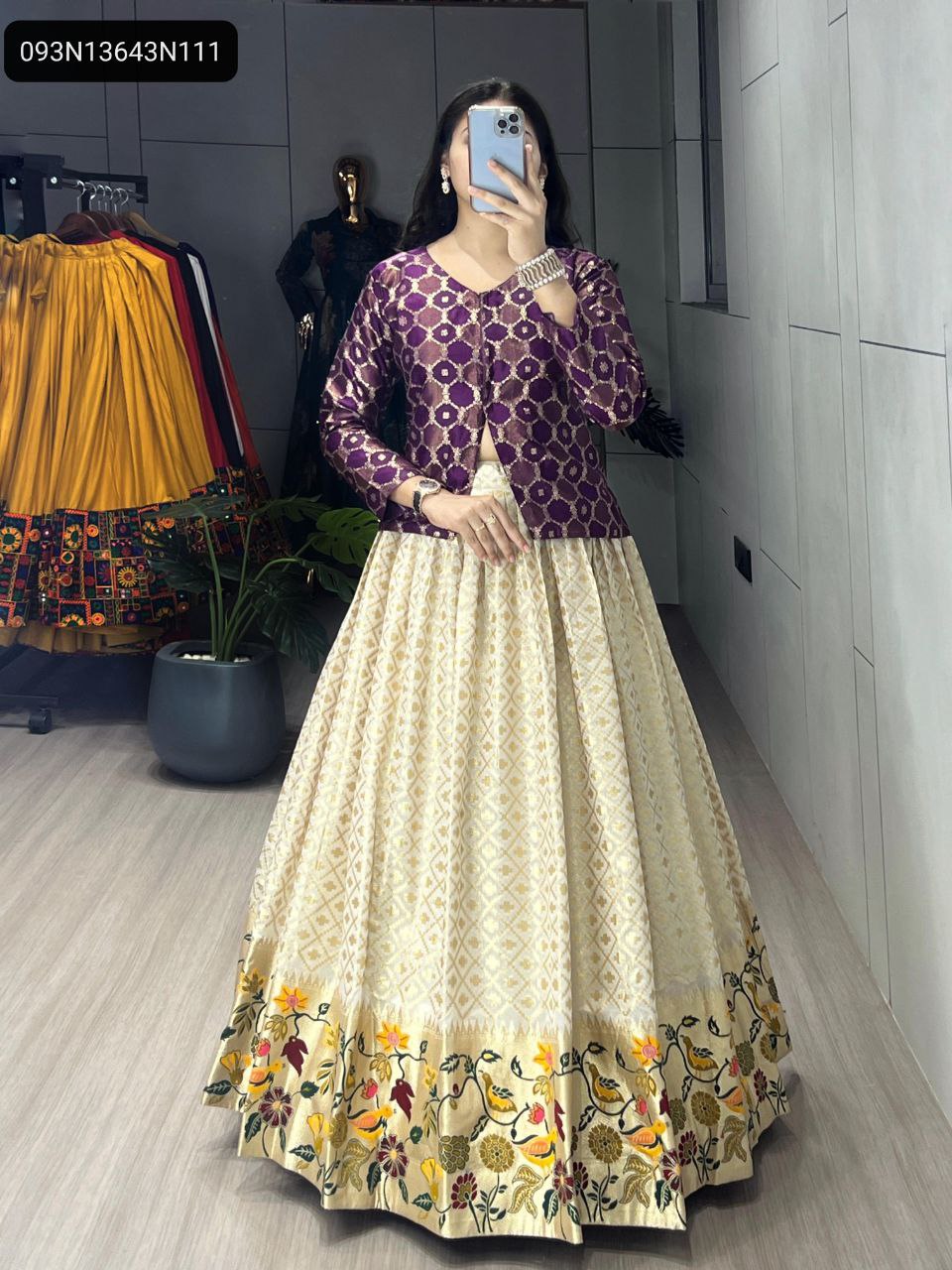 TRENDBUY model in full shot showcasing off-white Jacquard silk Paithani lehenga with vibrant embroidered border and purple Zari weaving Koti top, elegant pose.