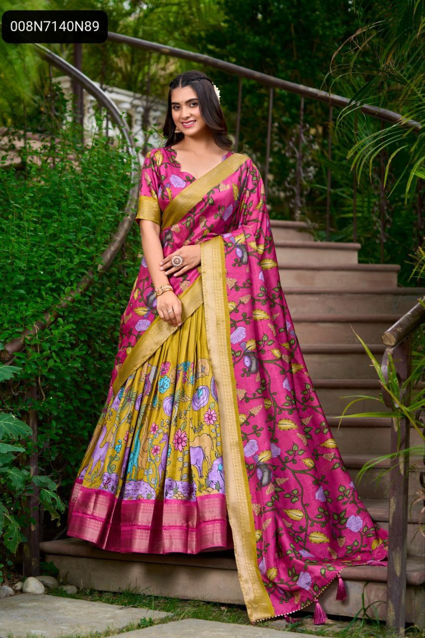 TRENDBUY Kalamkari Dola Silk lehenga choli in mustard yellow and pink, model smiling frontally on garden stairs, highlighting vibrant prints and zari border.