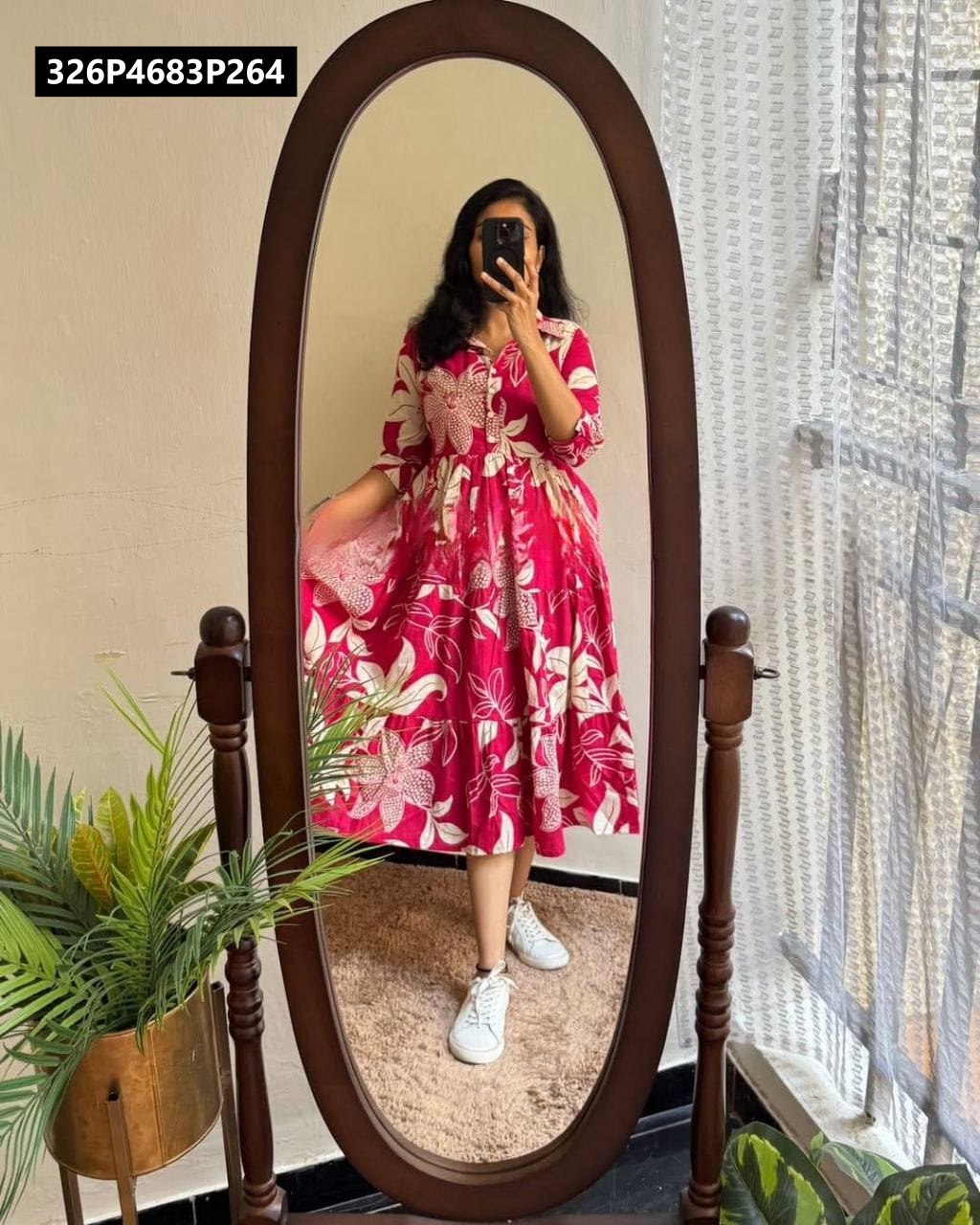Full body mirror shot of a woman wearing a TRENDBUY magenta and white floral tiered muslin midi dress with white sneakers.