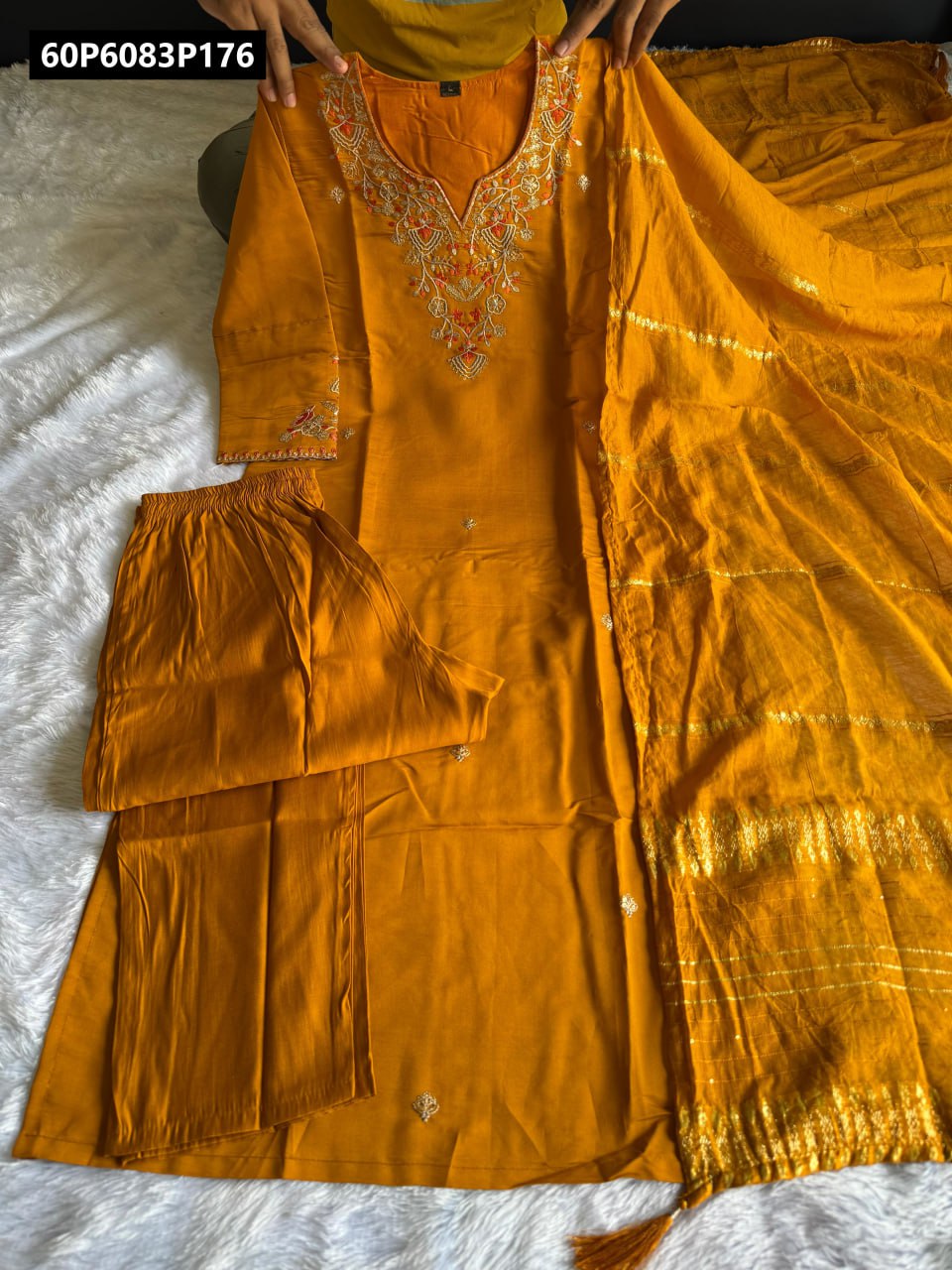 Full length view of TRENDBUY Mustard embroidered kurti set, including the kurti, pleated pant, and flowing cotton silk dupatta with zari work, held to display the complete outfit against a white background.