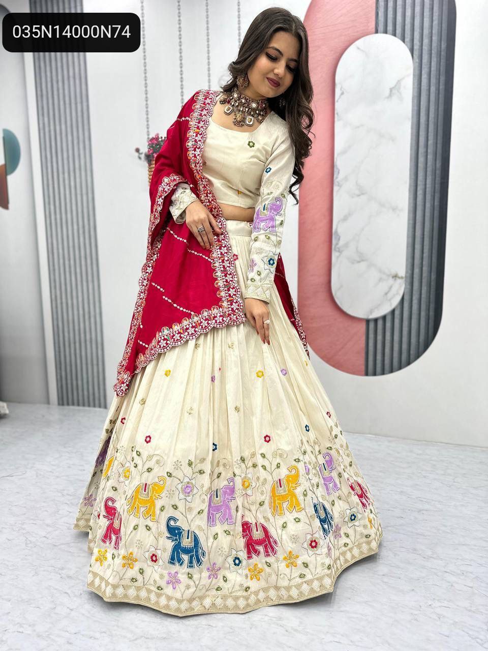 Elegant full model shot of a woman in the TRENDBUY Off-White Tissue Silk Lehenga Choli paired with a striking red Vichitra Silk dupatta, showcasing the voluminous flair and rich embellishments.
