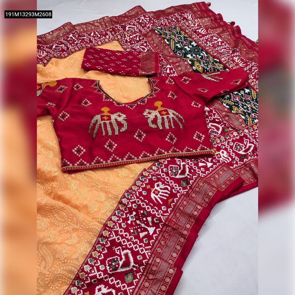 TRENDBUY Orange Georgette Chikankari Saree displayed with a red Patola border, a red embroidered elephant blouse, and a matching contrast Patola blouse piece.