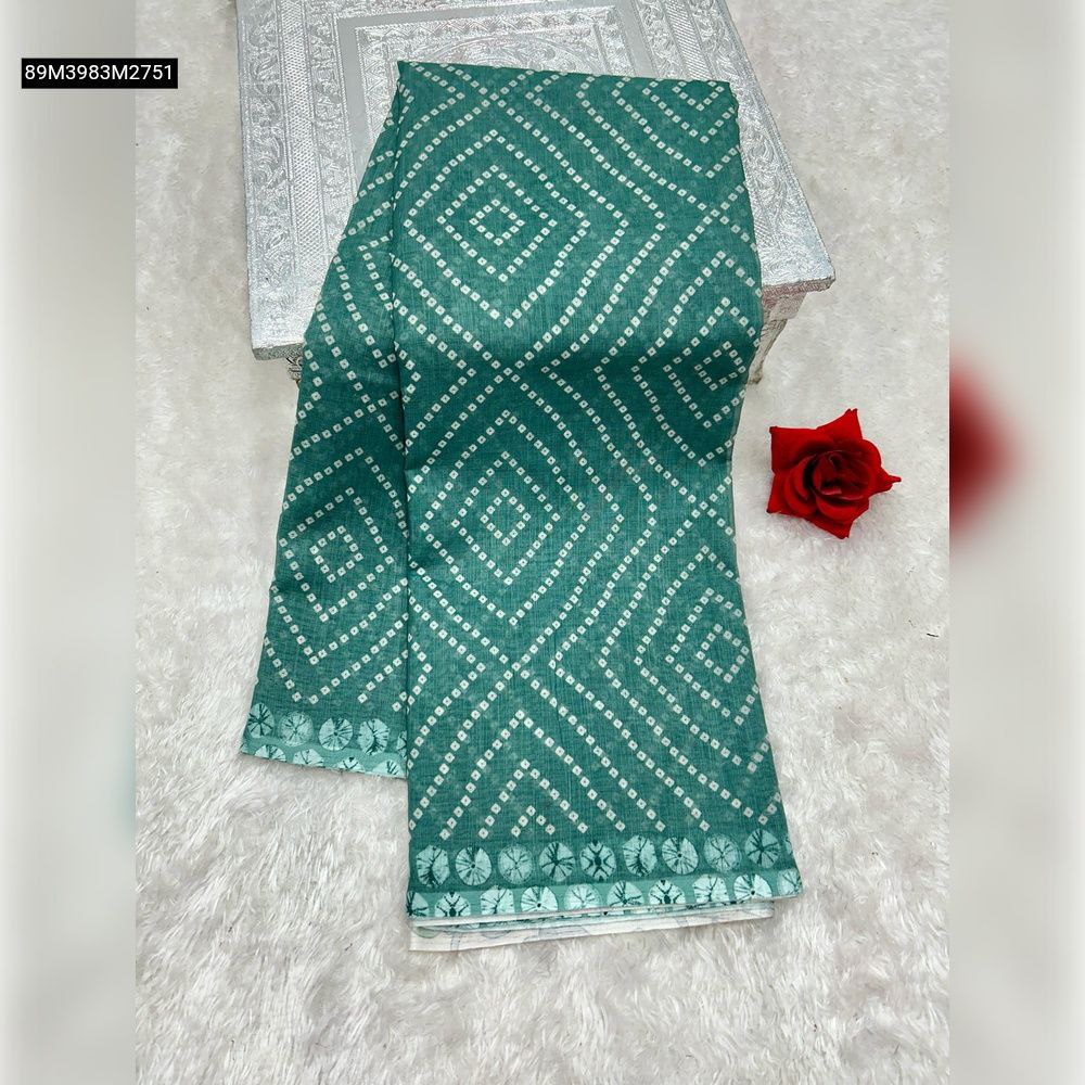 TRENDBUY Teal Green pure linen cotton saree, folded on a silver box, featuring white bandhani-style geometric digital print, with a decorative red rose.