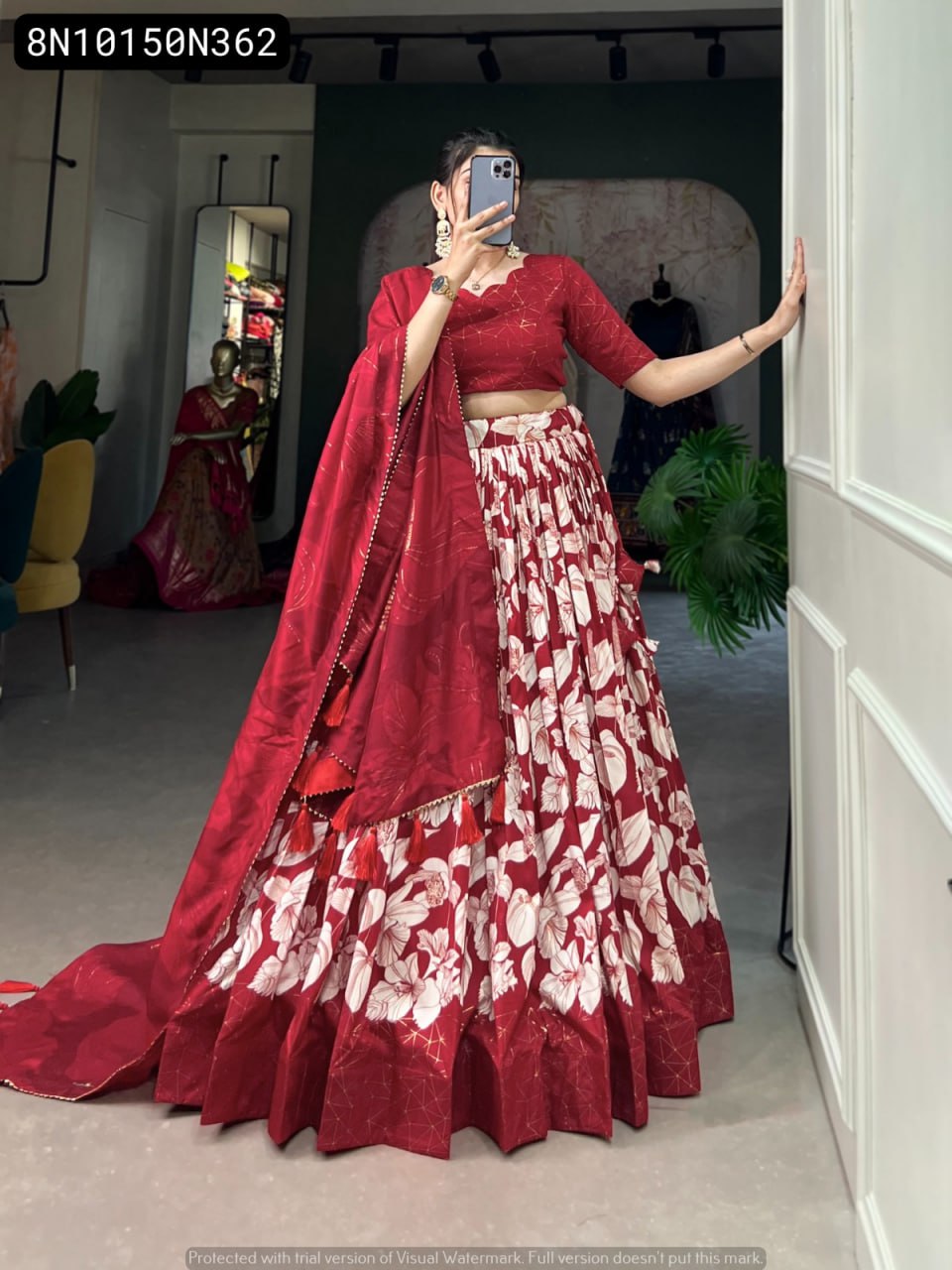 Full body view of model wearing TRENDBUY Red Floral Print Tasar Silk Lehenga Choli, showcasing the entire outfit's flair, foil print blouse, and dupatta with tassels.