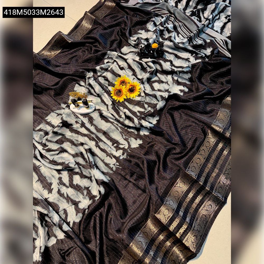 TRENDBUY Black Semi Dola Silk Saree draped with white abstract pattern, Riko Zari work, and golden weaving borders, featuring small yellow sunflowers as props.